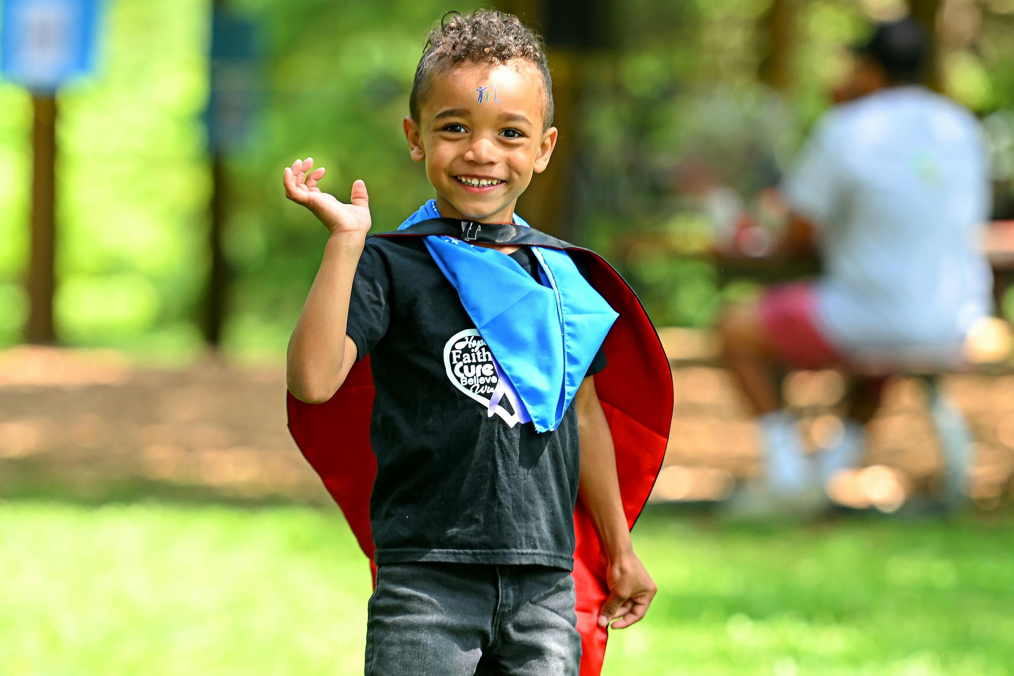 Young boy in red cape at the Kitchener Walk