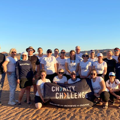 group of trekkers pose for a photo in Morocco