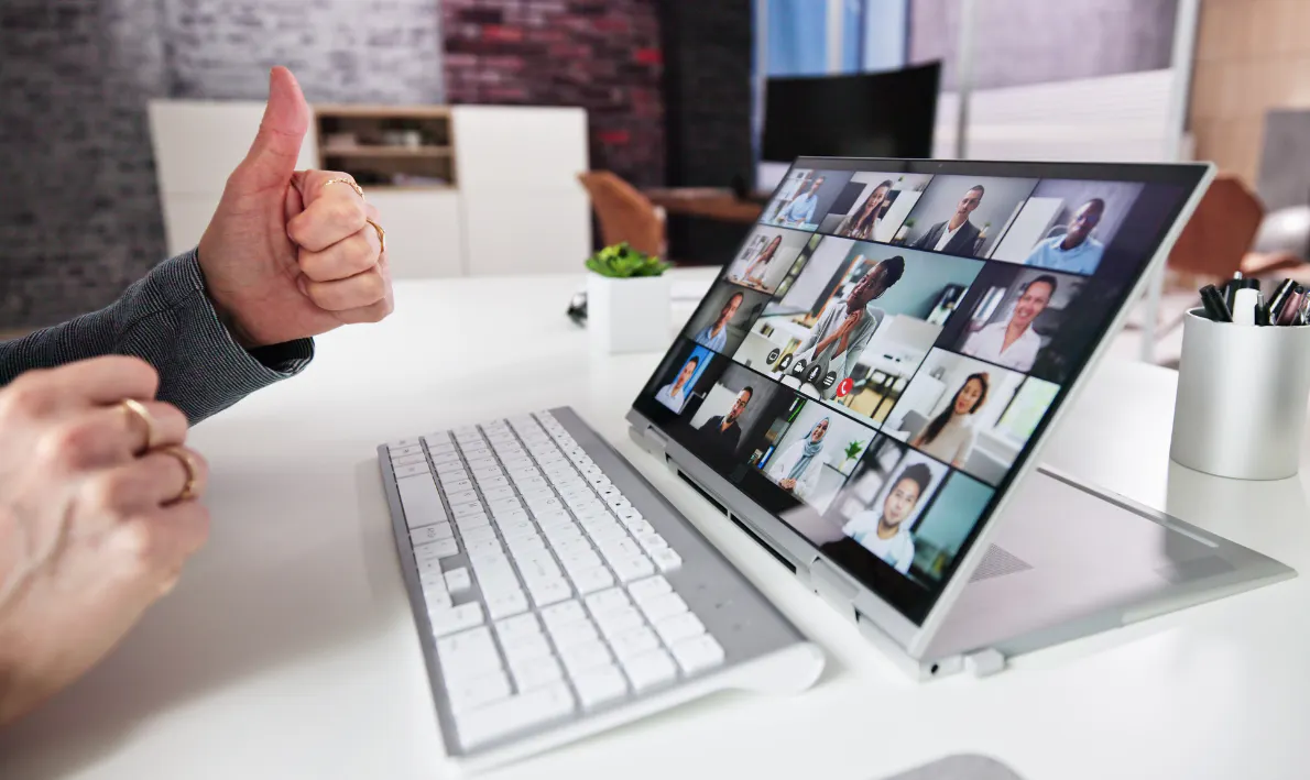 A computer showing a group meeting online.