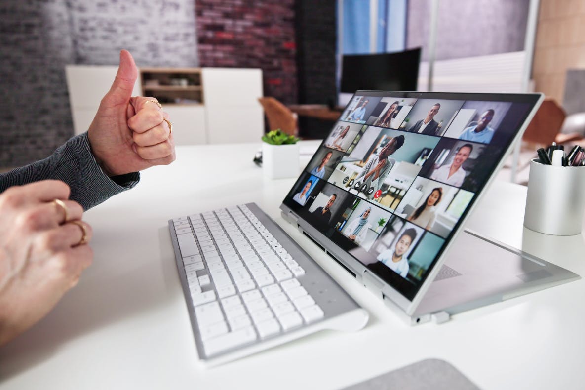 A computer showing a group meeting online.