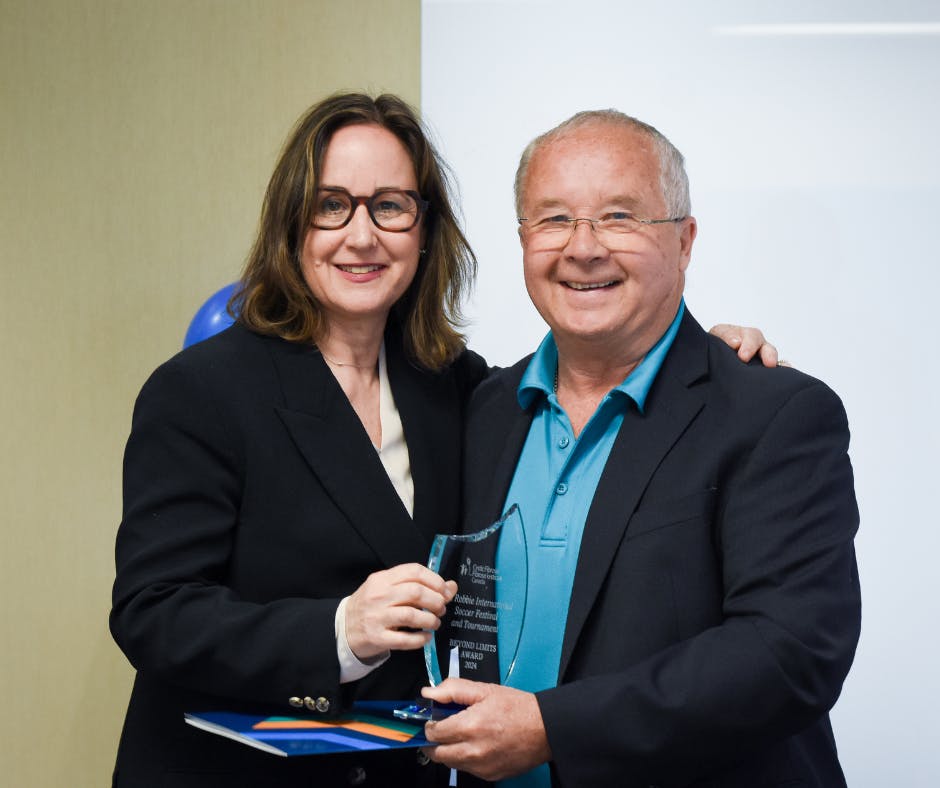 Ron from the Robbie soccer tournament with Kelly Grover