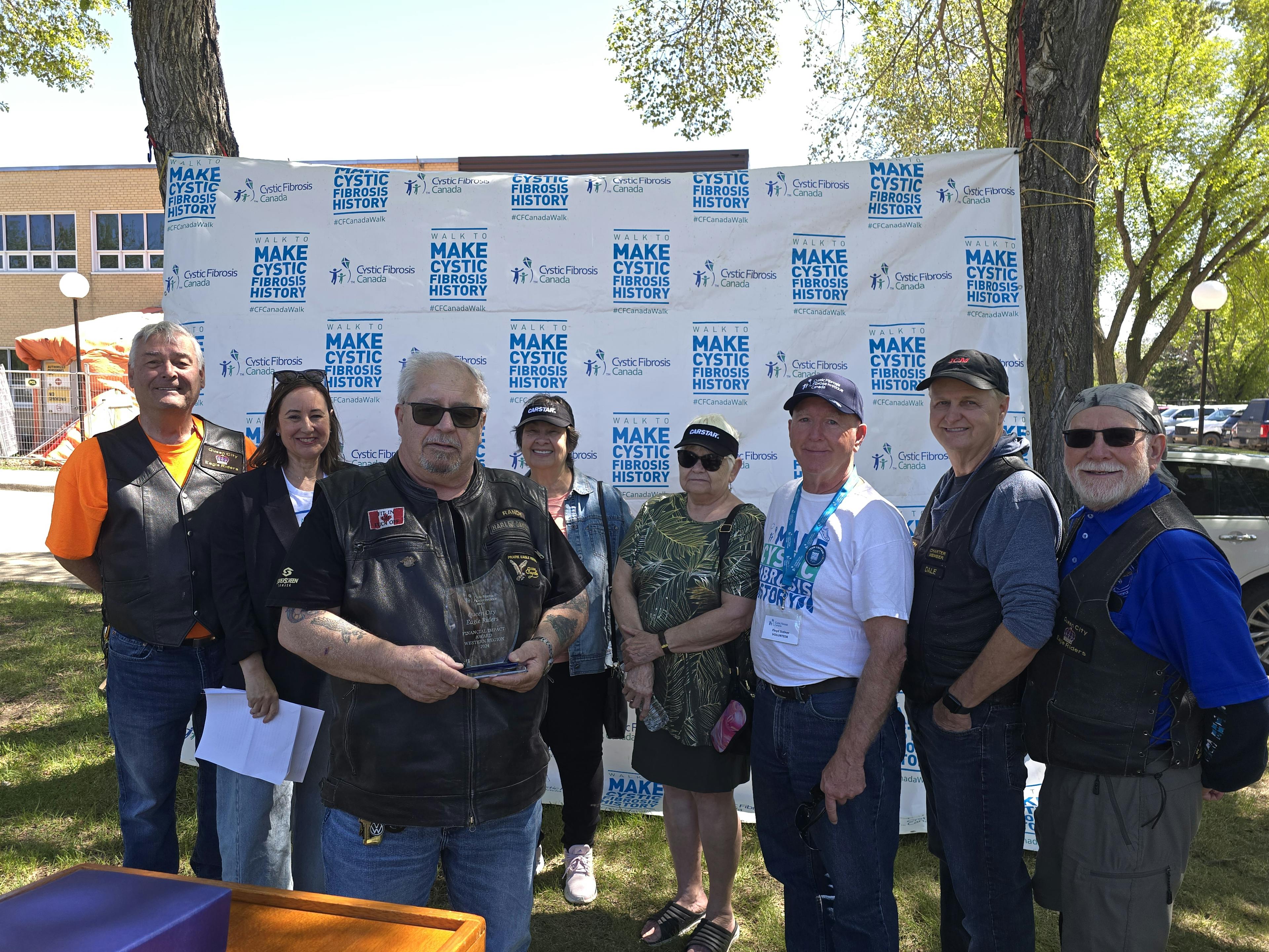 Queen City Eagle Riders accept the Financial Impact Award, Western Region from Kelly Grover