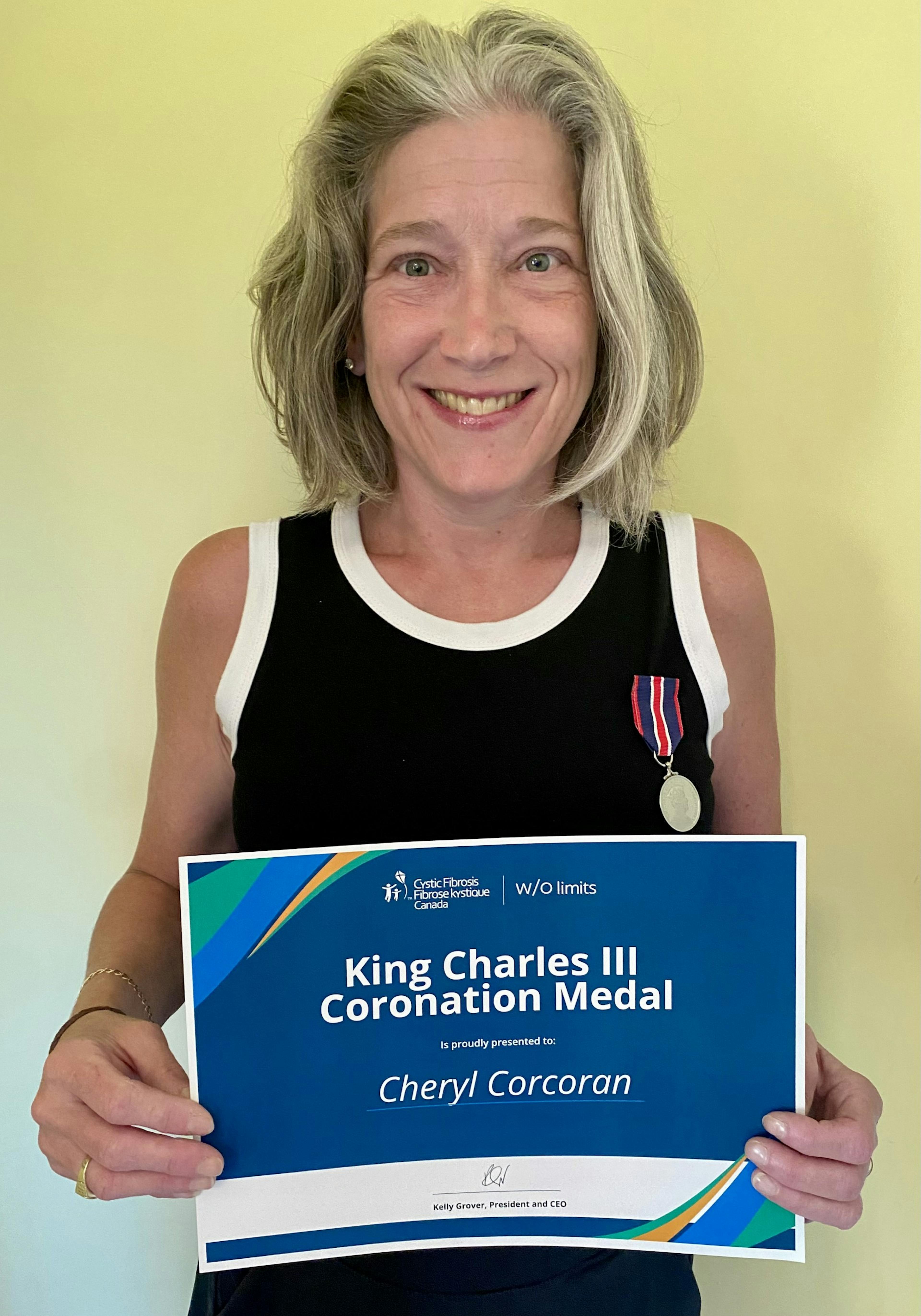 Cheryl Corcoran receives her King Charles III Coronation Medal