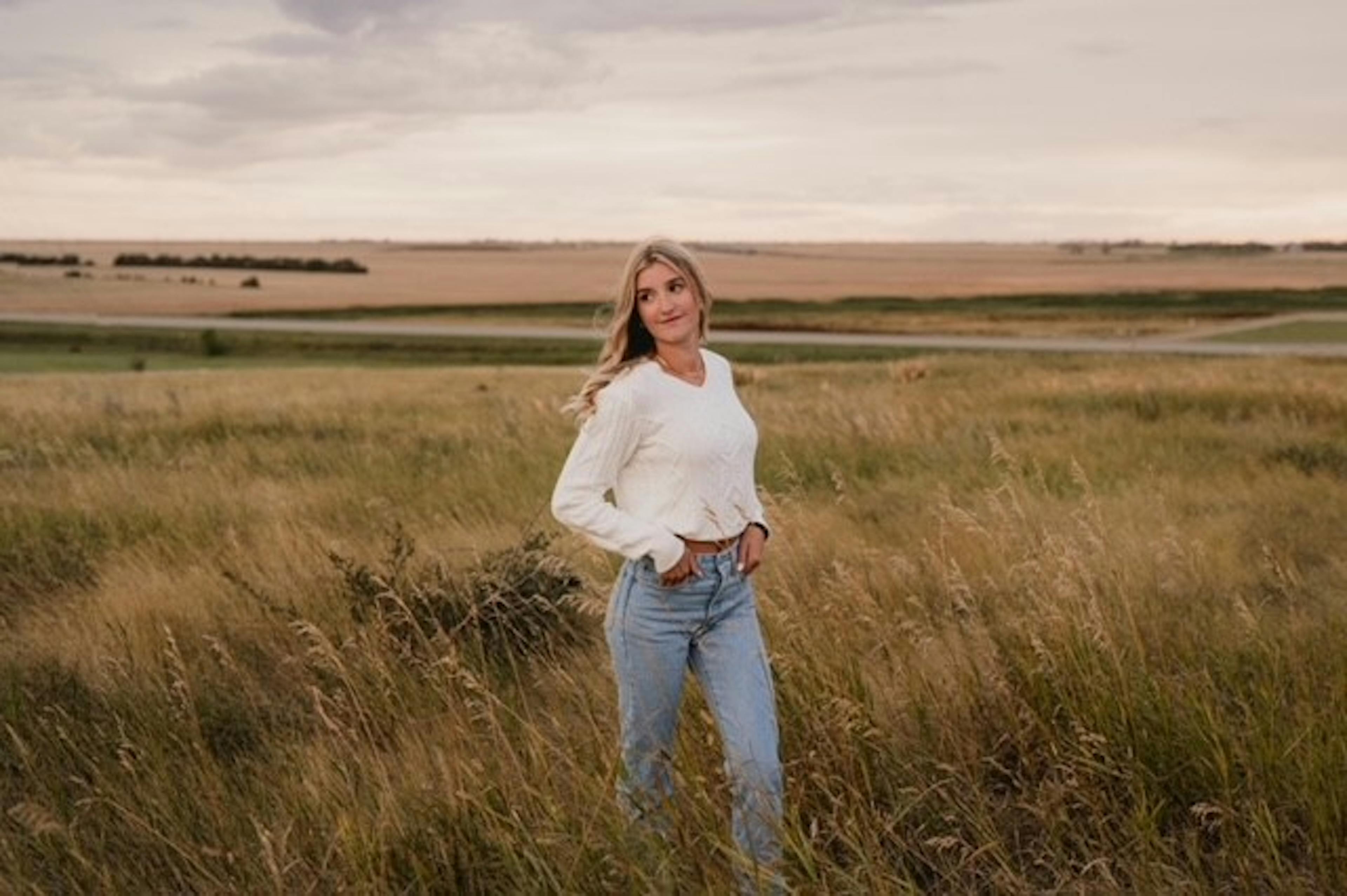 Teresa Weger in an open prairie field