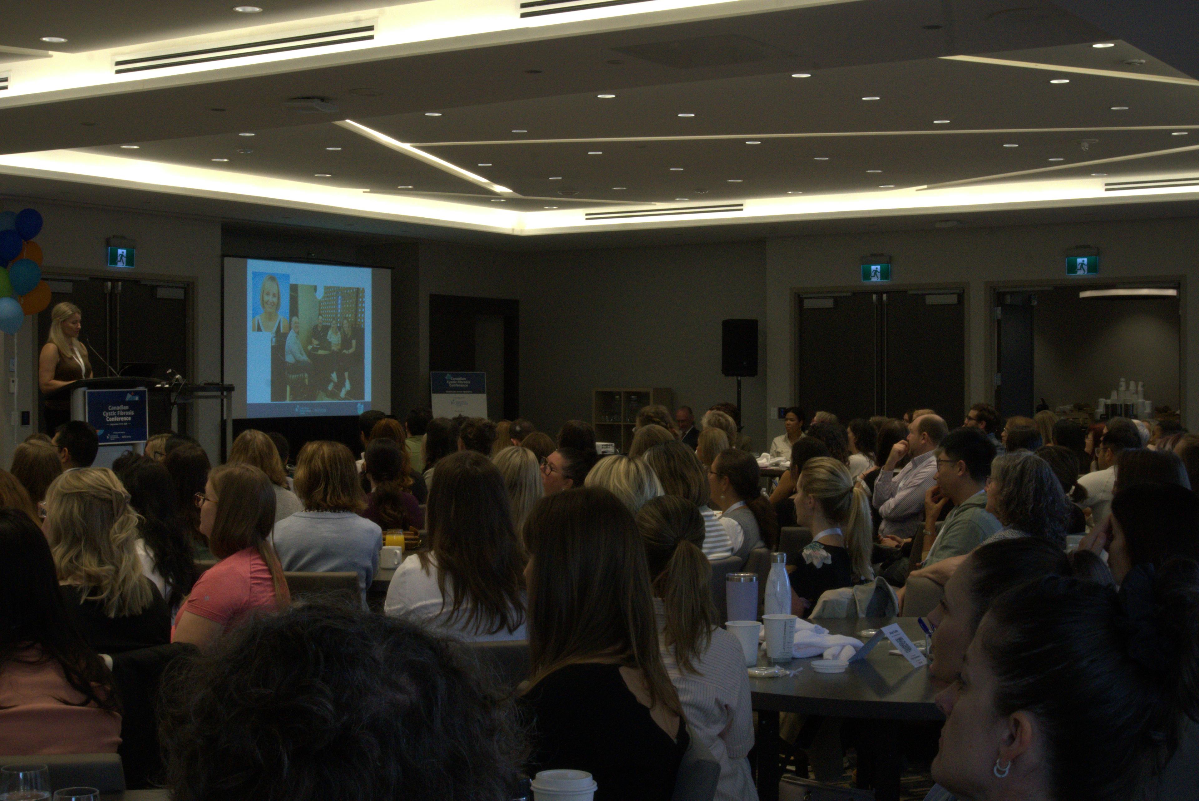 Jana Koroucek of CF Canada presenting Dr. Elizabeth Tullis