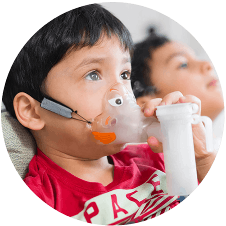 A young boy using his nebulizer for CF treatment. 
