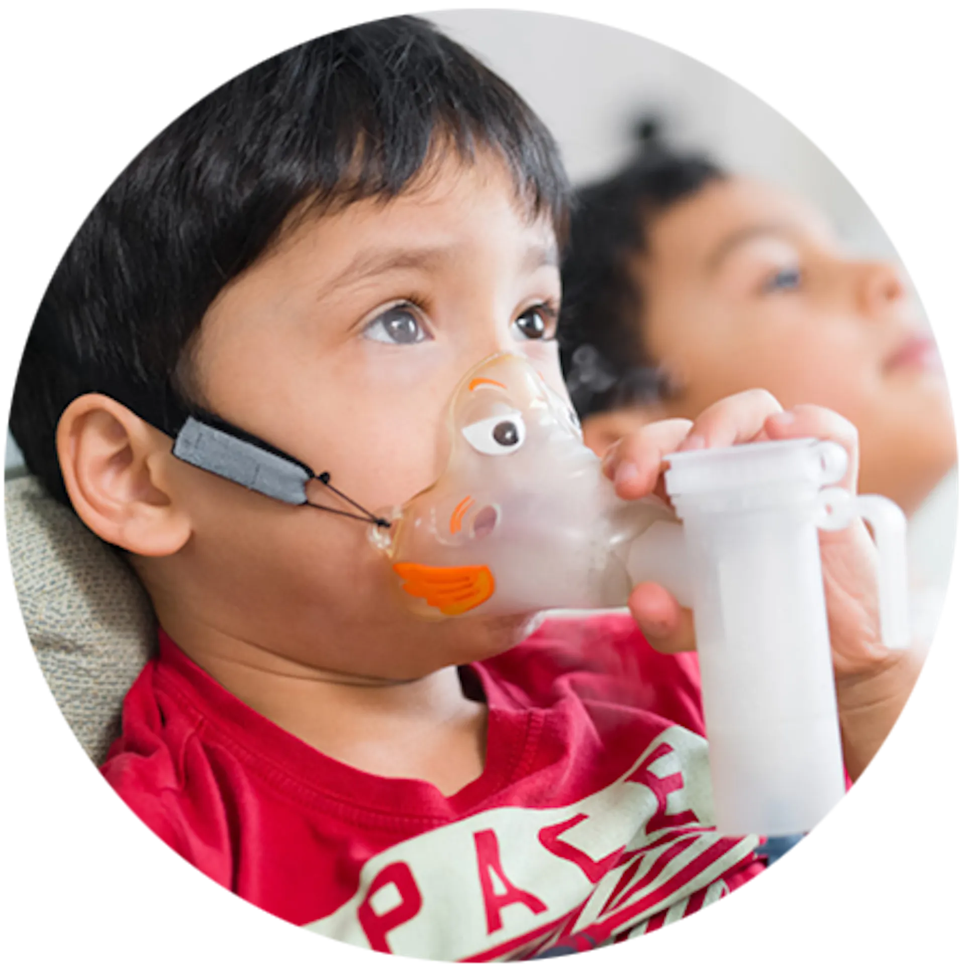 A young boy using his nebulizer for CF treatment. 