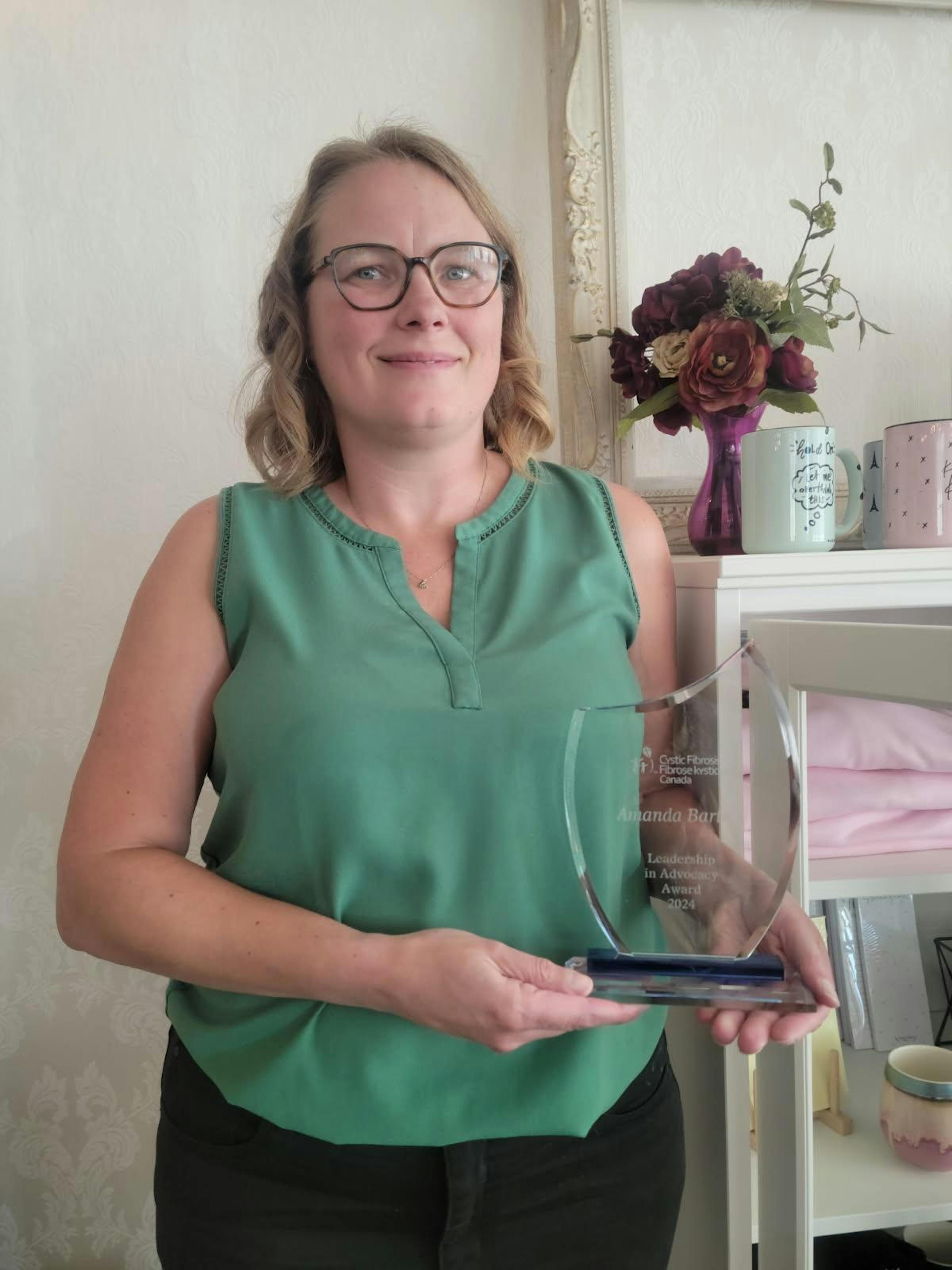Amanda poses with her CF Canada Leadership in Advocacy Award