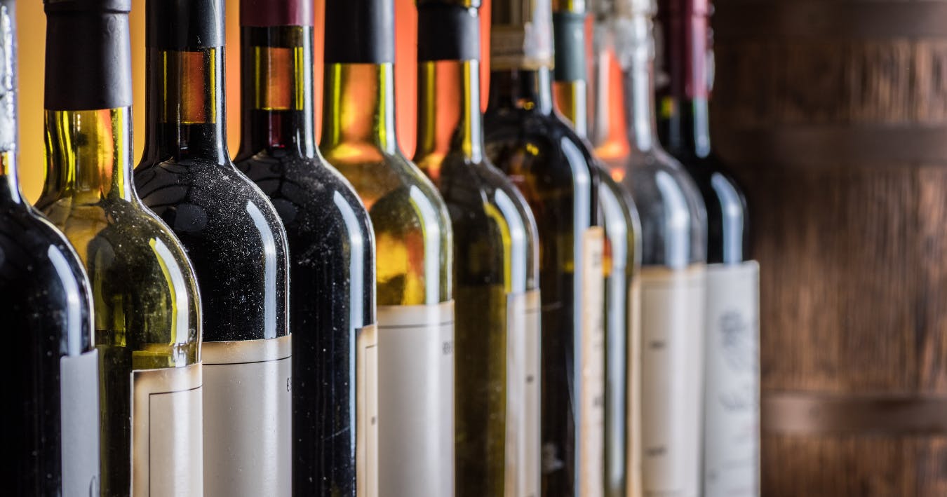 Bottles of fine red wine in a row.