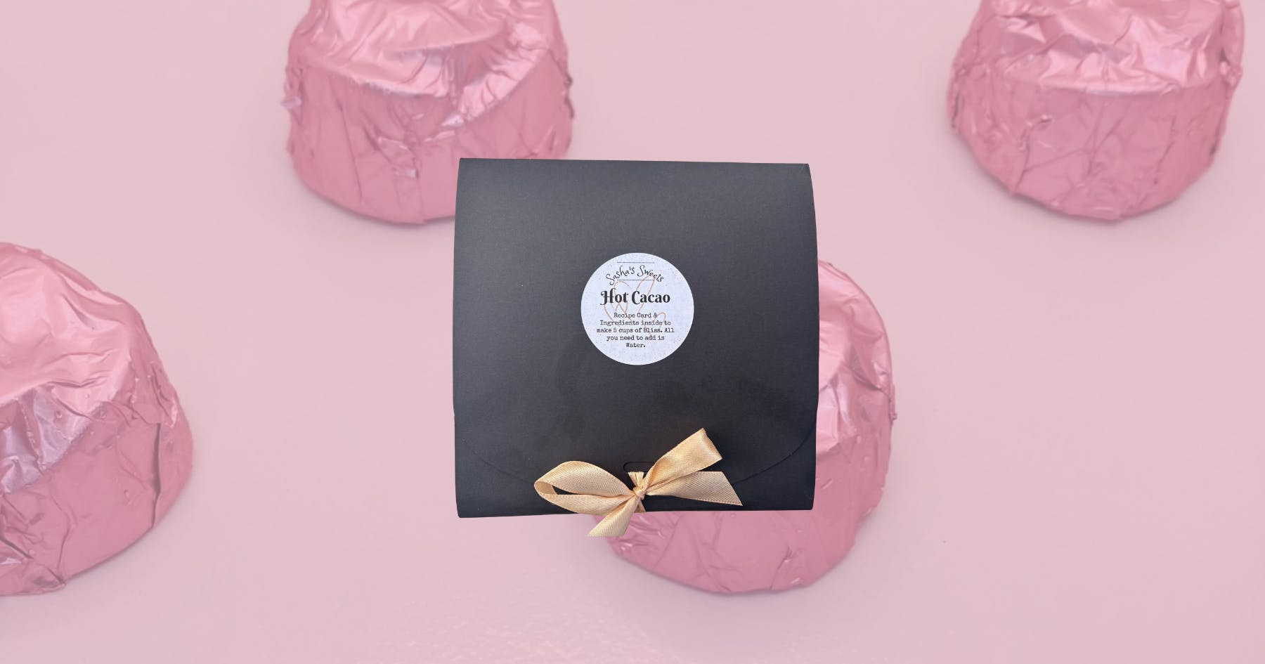 A box of chocolate on a pink background