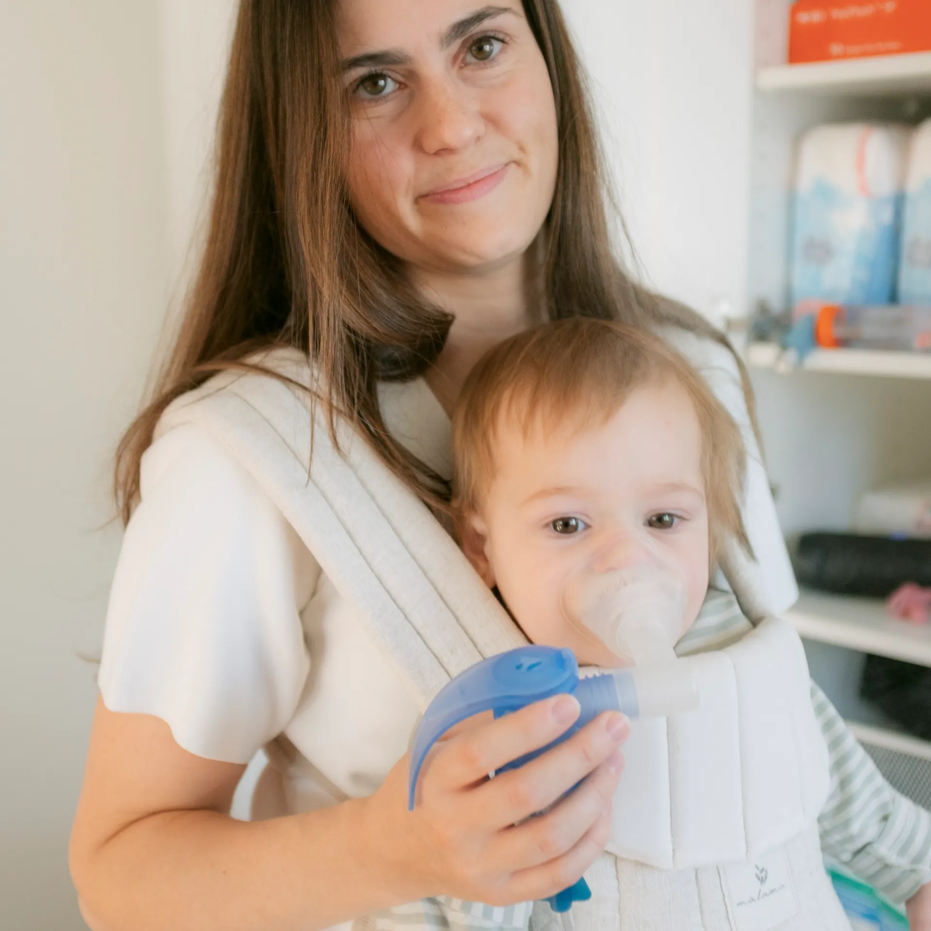 Marie-Joelle with her baby daughter Lucie, who is doing a breathing exercise 