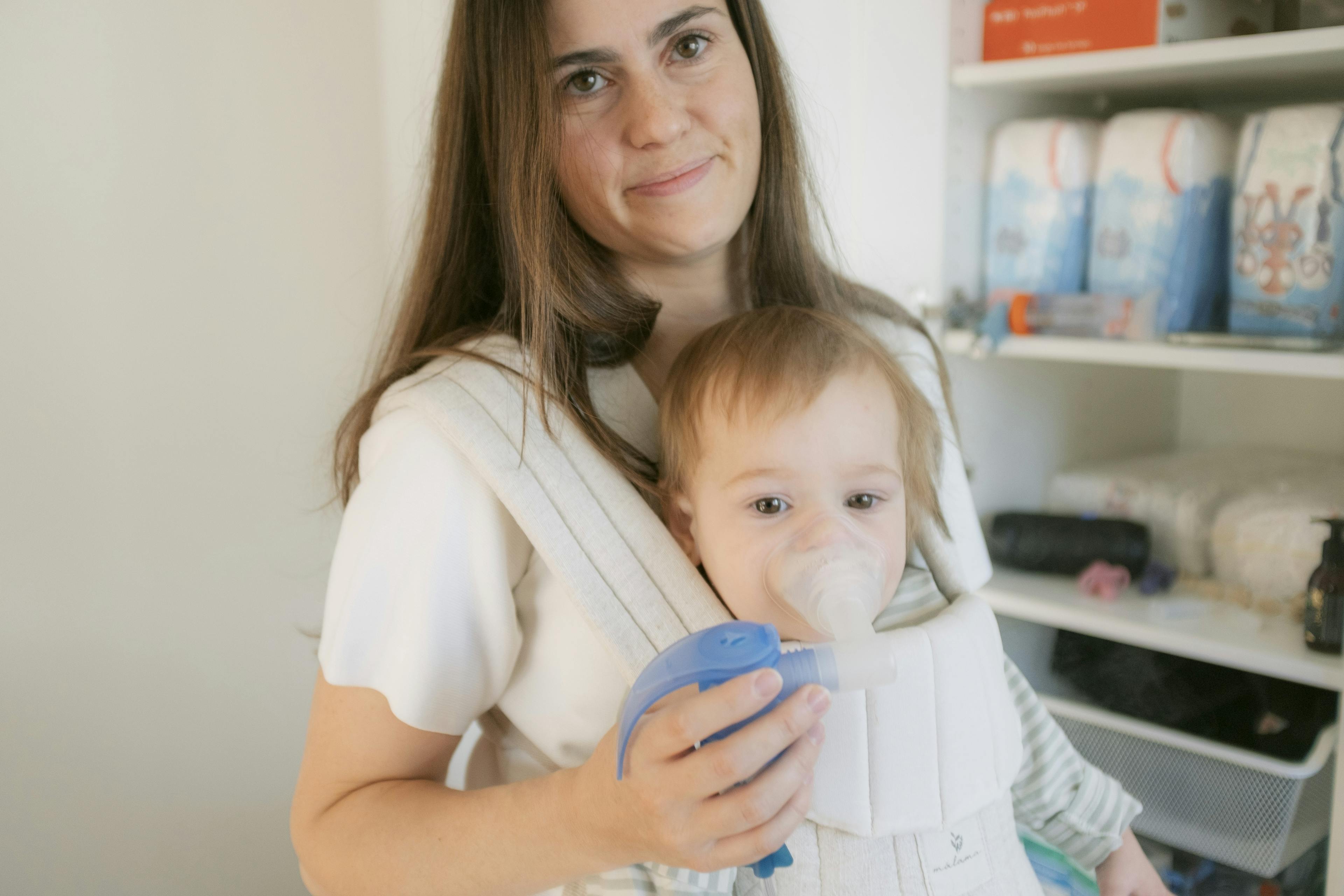 Marie-Joelle with her baby daughter Lucie, who is doing a breathing exercise 