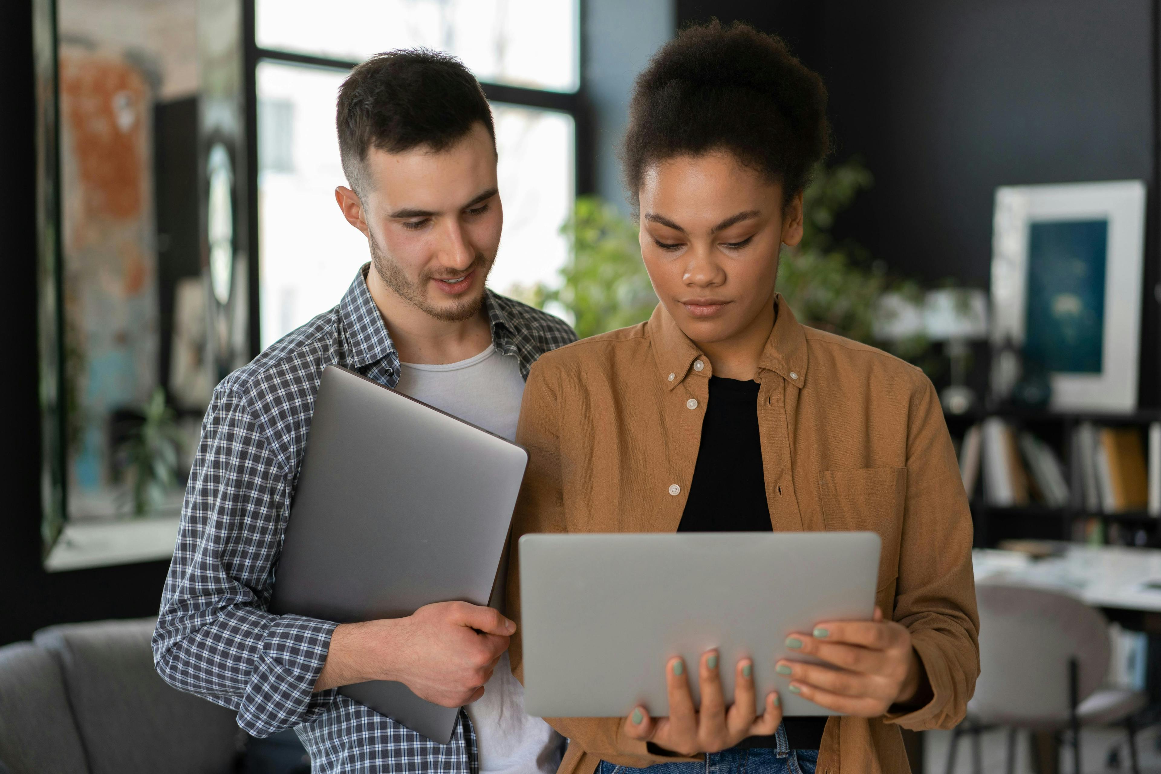 Man and woman looking at laptop