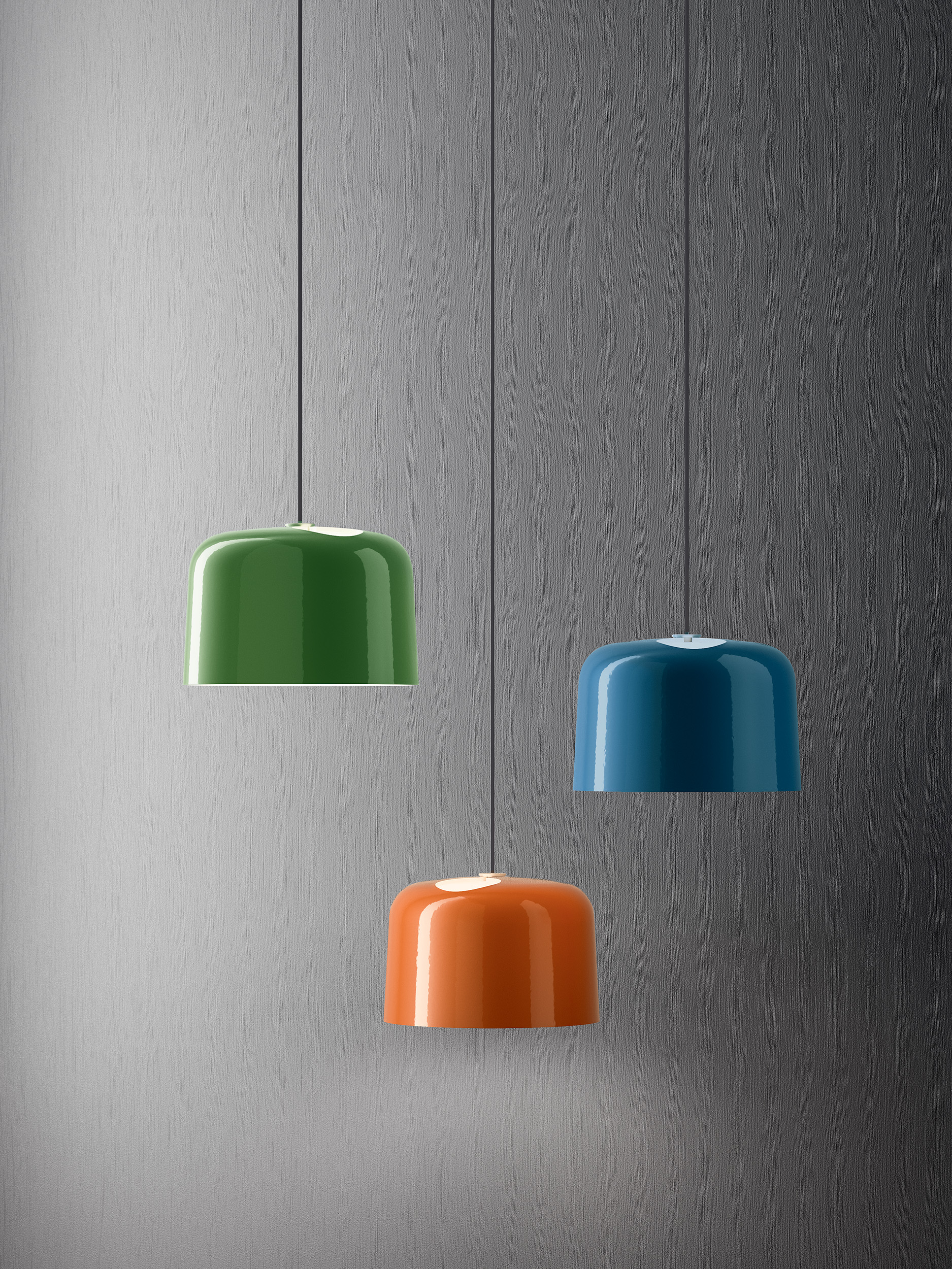 Vue de face de trois luminaires vert, orange et bleu design, produit de Dacota