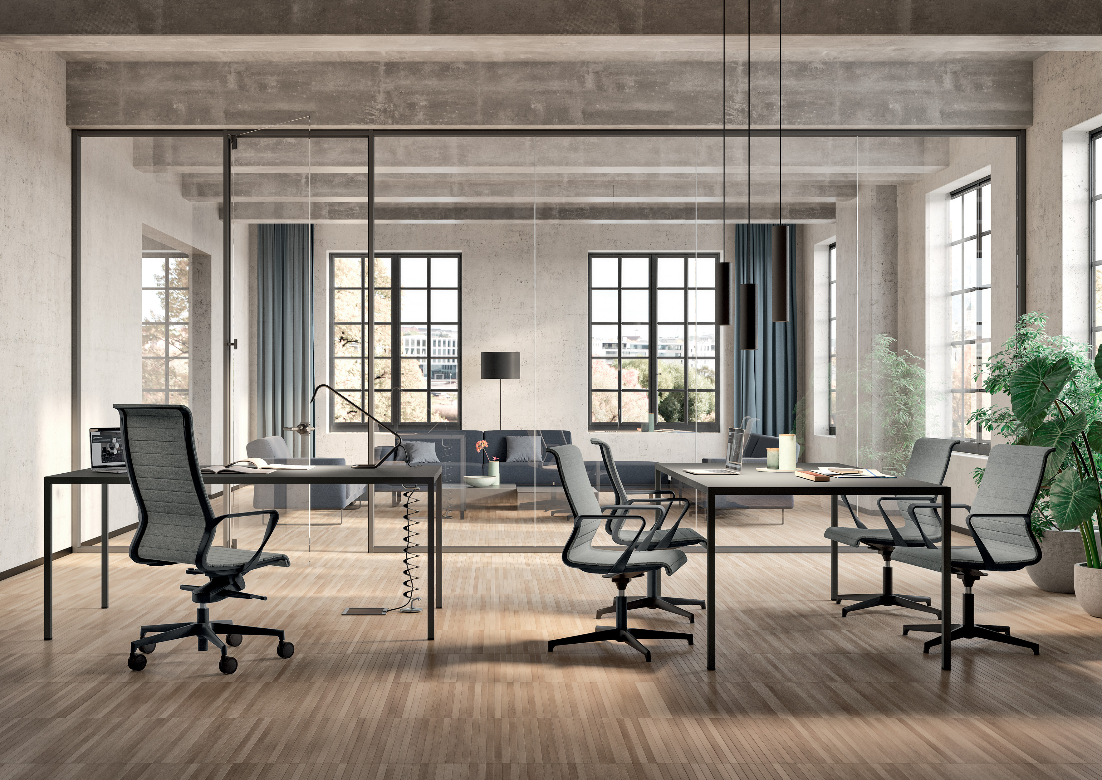 Un espace de travail avec des bureaux séparés par des cloisons