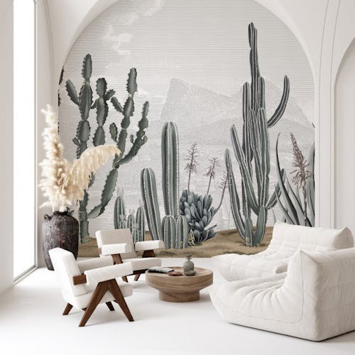 Un salon avec deux petits sièges, deux fauteuils et un papier peint personnalisé avec des cactus sous forme de dessin