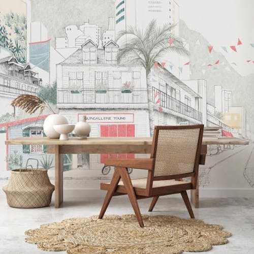 Un bureau avec une table, une chaise et un papier peint personnalisé avec une vue d'une rue et des bâtiments sous forme de dessin