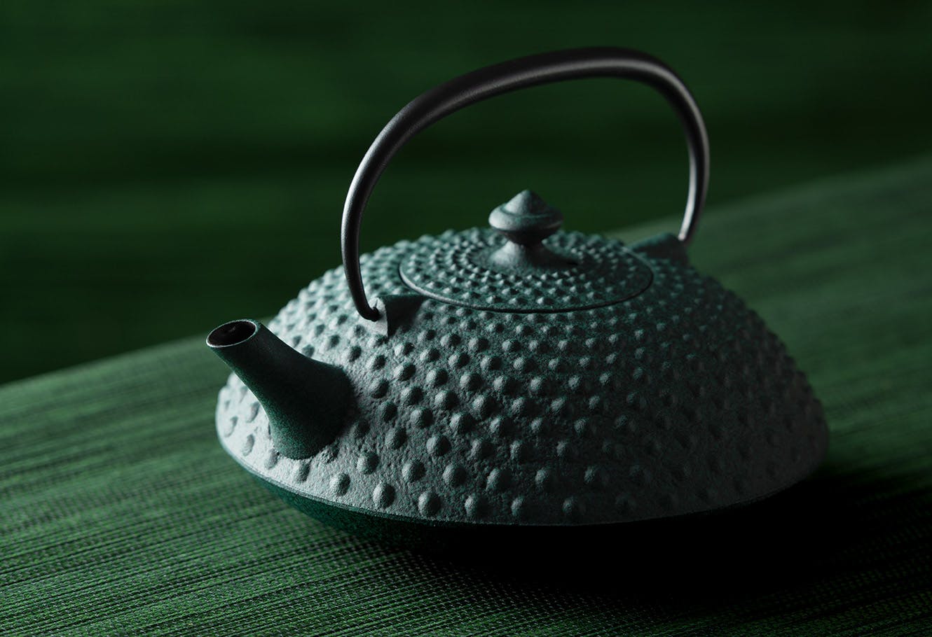 Green Japanese cast iron teapot.