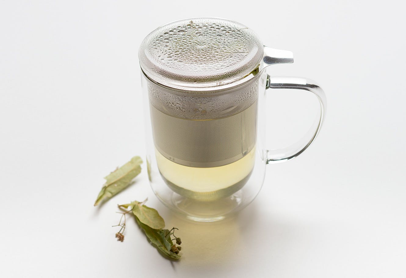 Infusion of plants in an herbal tea pot.
