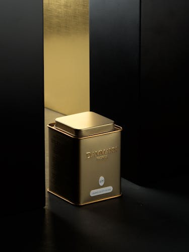 Tea canister, golden finish metal.