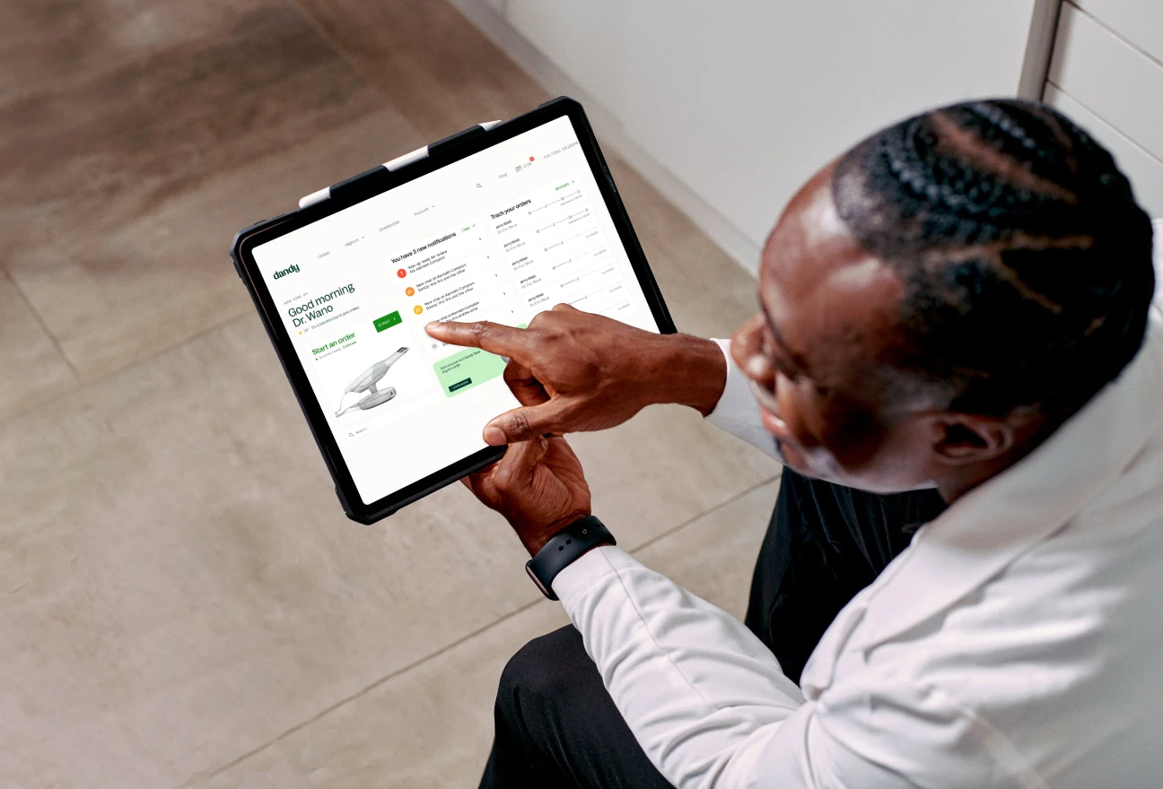 Dentist reviewing a case on a tablet