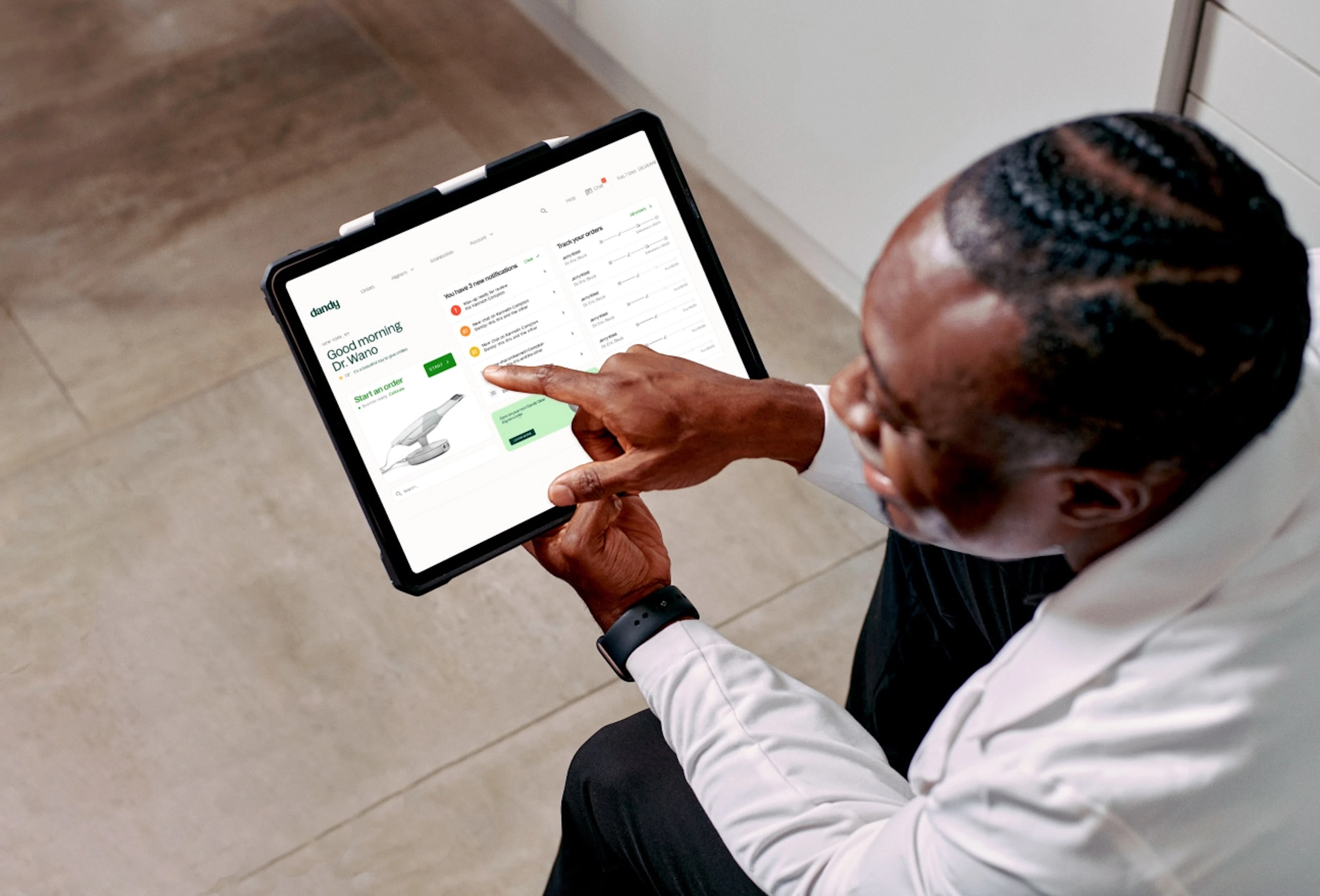 Dentist reviewing a case on a tablet