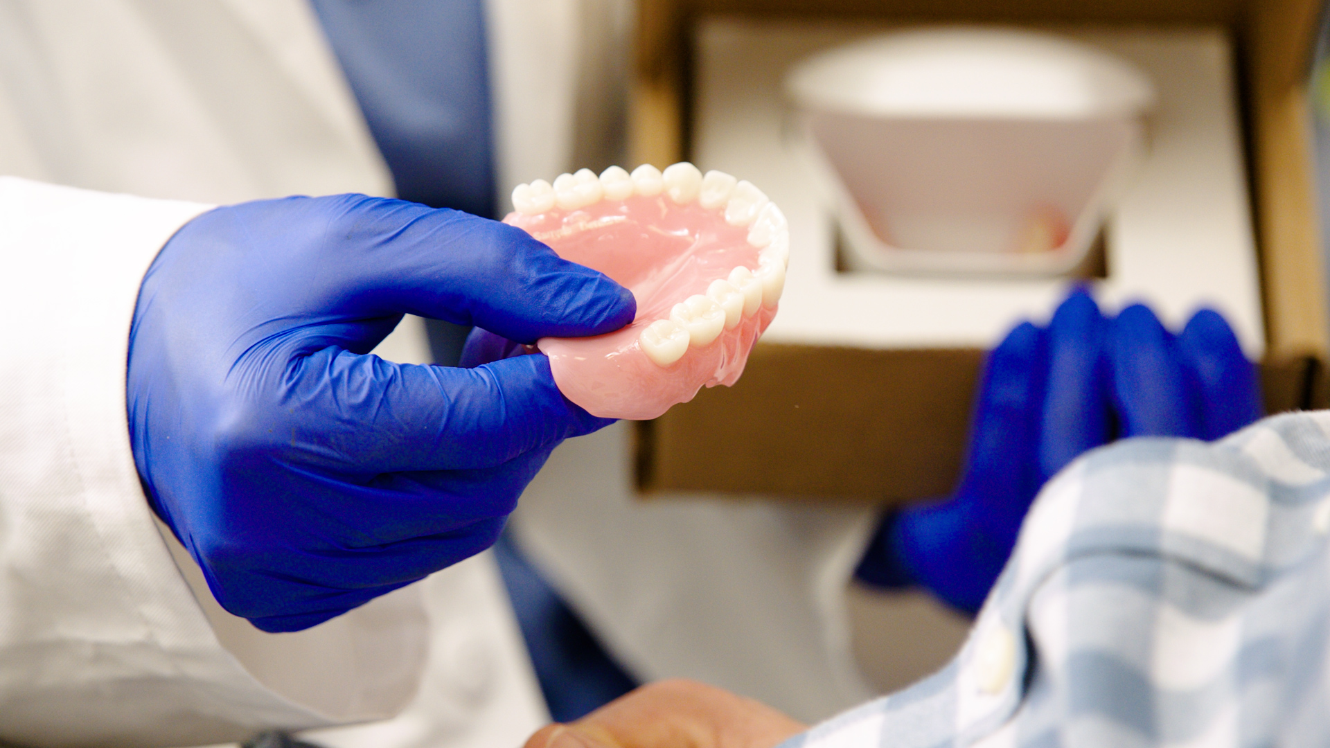 dandy dentist delivering dentures