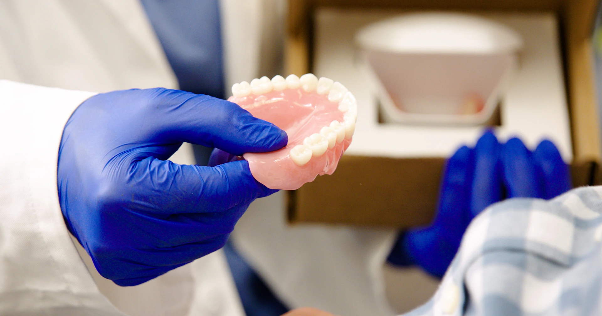 dandy dentist delivering dentures
