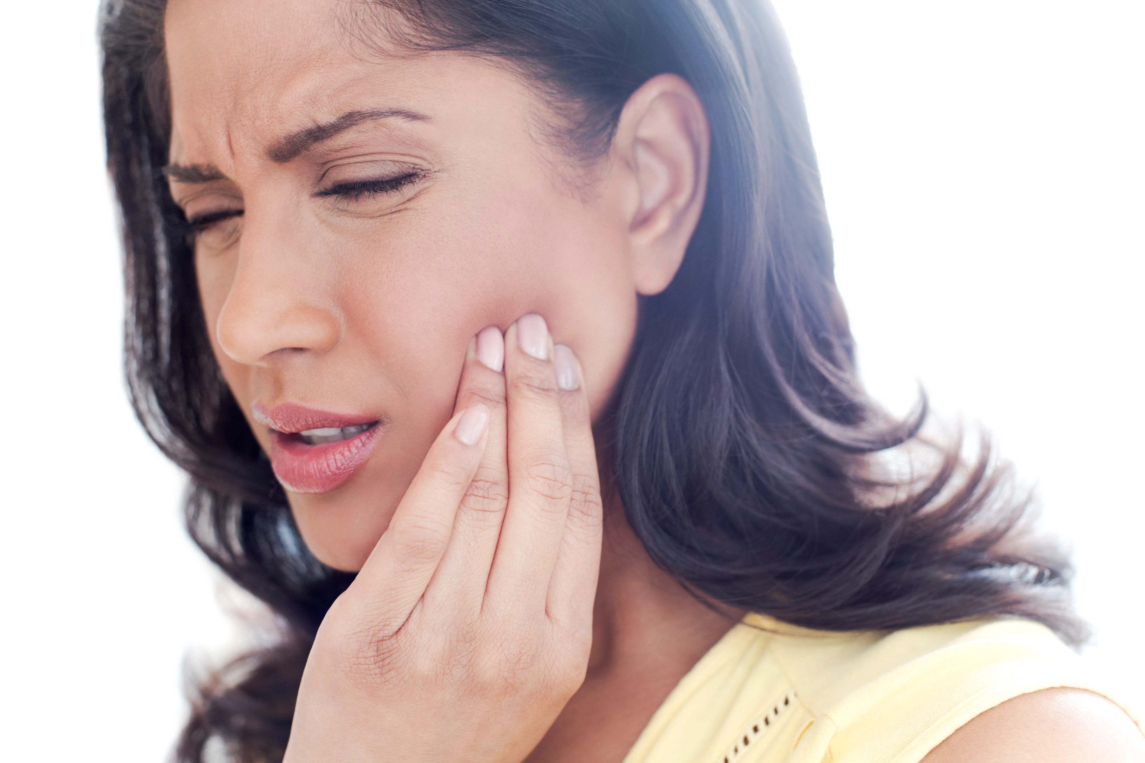Woman feels TMJ in her jaw