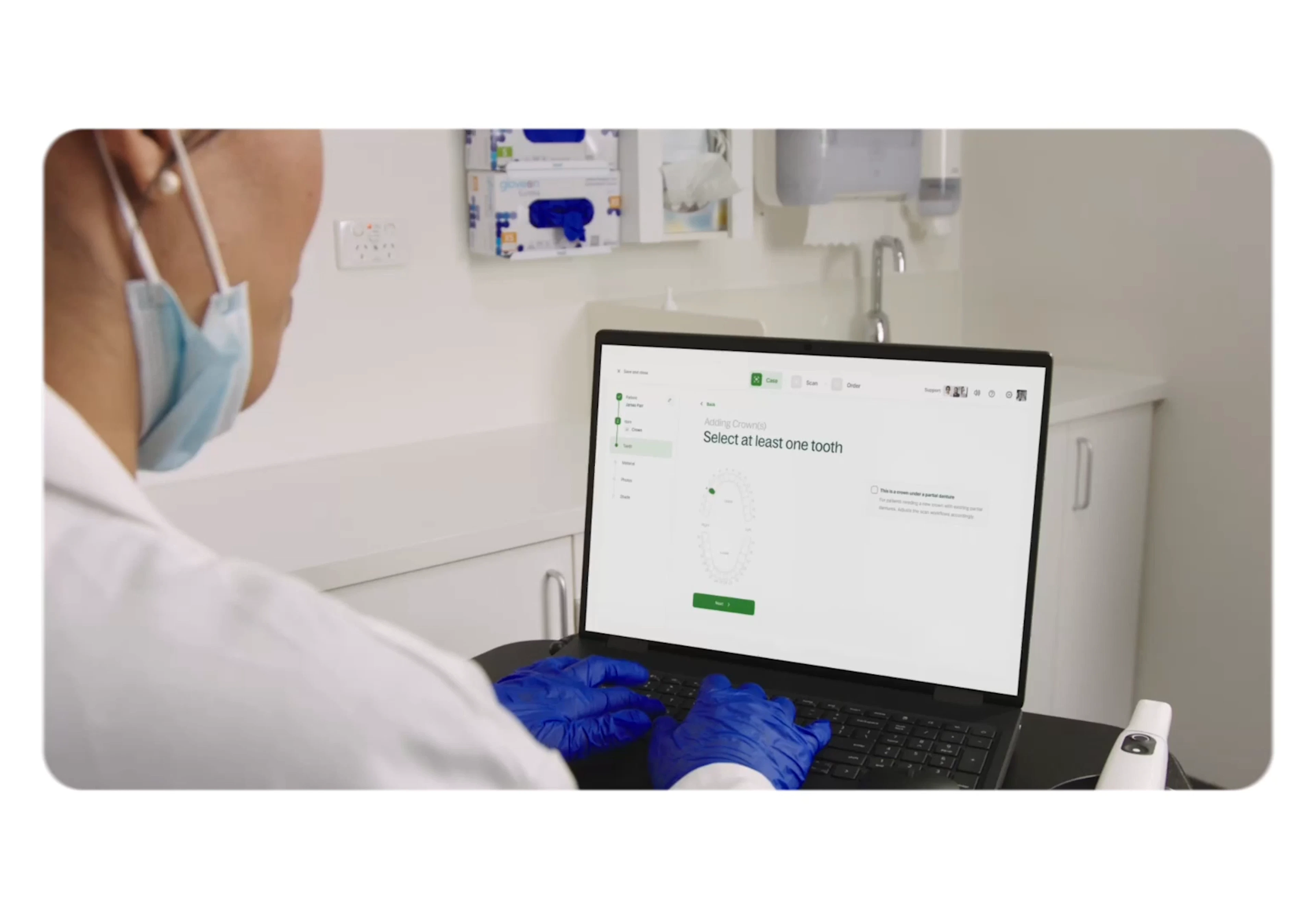 Dental professional reviewing a scan case on a laptop