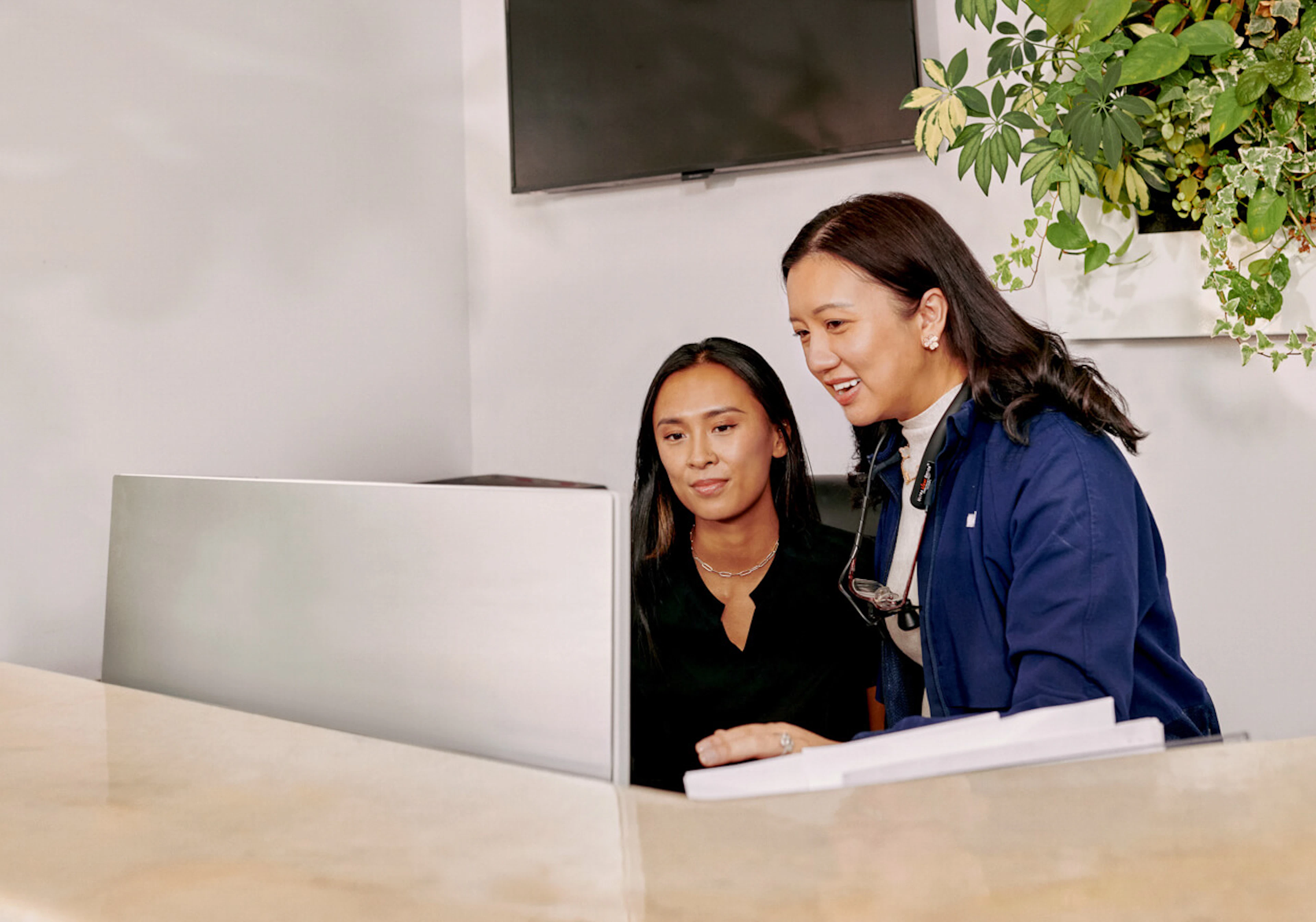 Dental office staff at reception desk