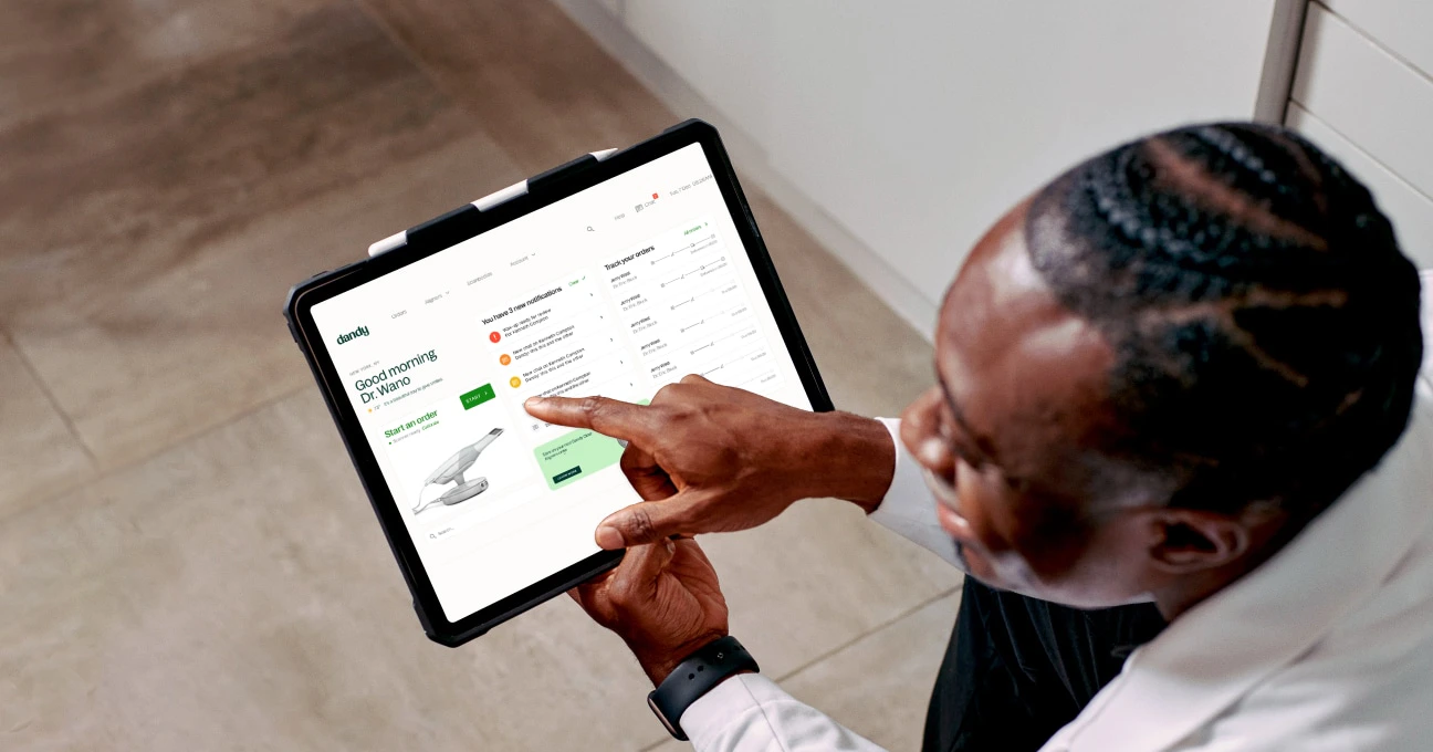Dandy doctor using application on tablet