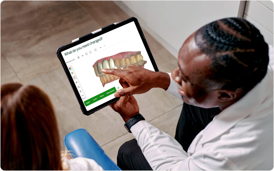 Dentist using tablet to review chairside scan