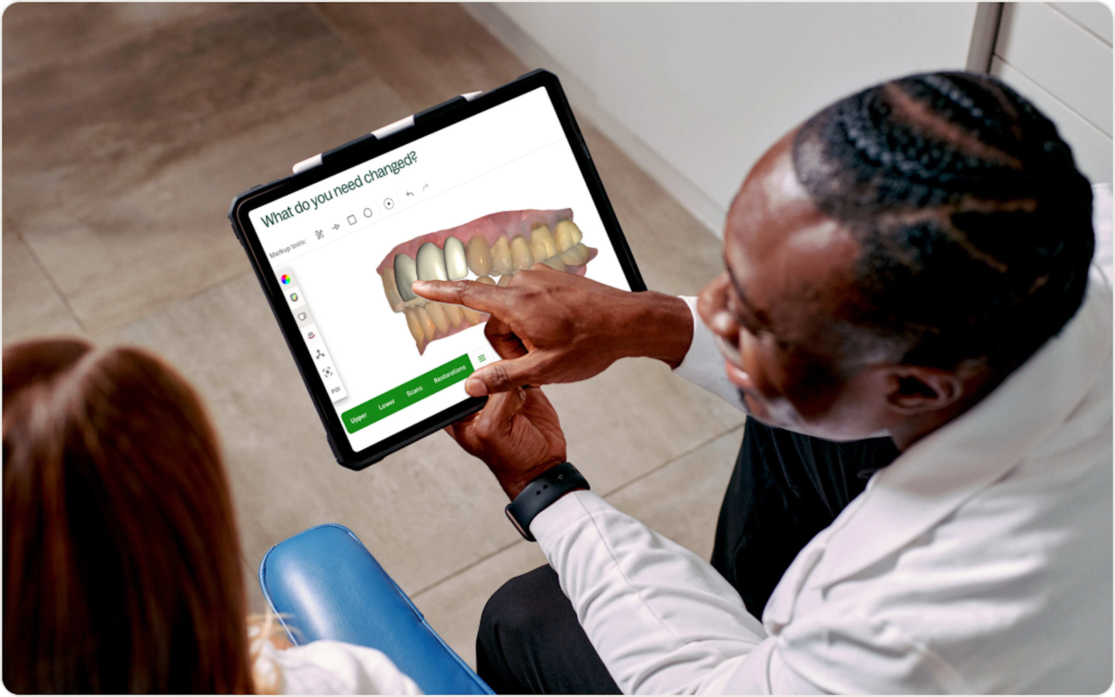 Dentist using tablet to review chairside scan