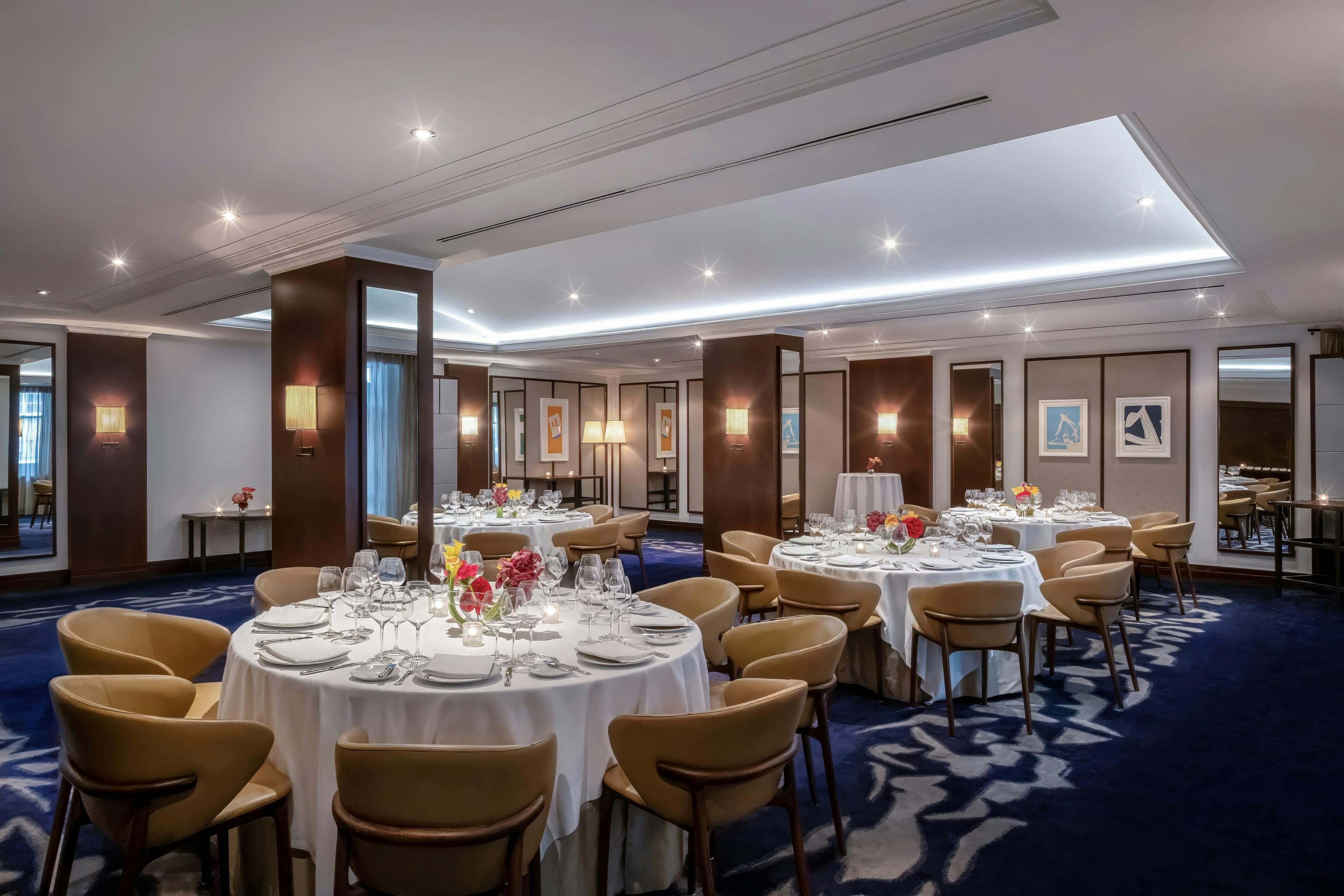 Interior of the Bellecour private dining room at Daniel with tables, chairs and table settings