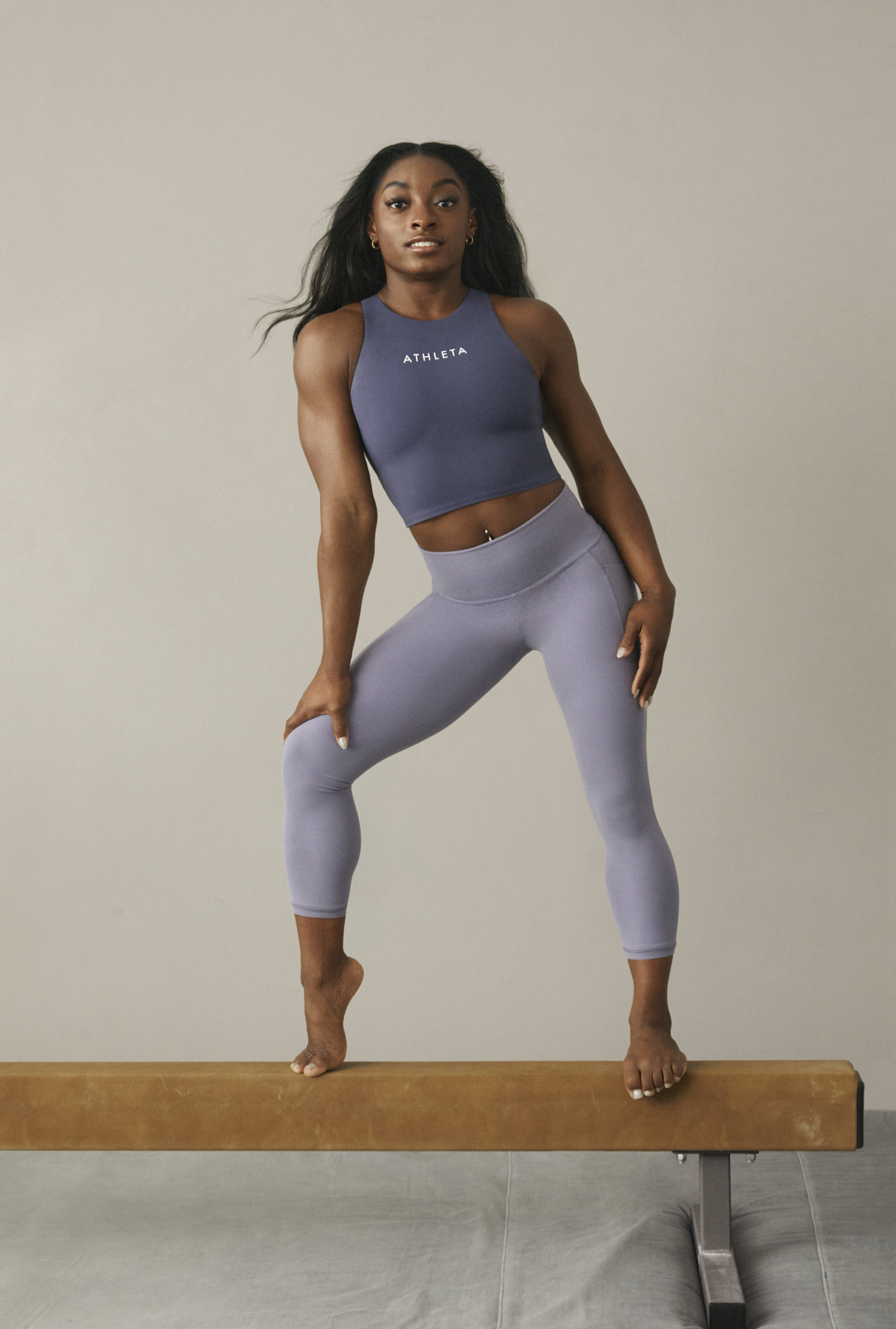 Simone Biles Takes Flight in Crop Top, Leggings & Versatile Dad