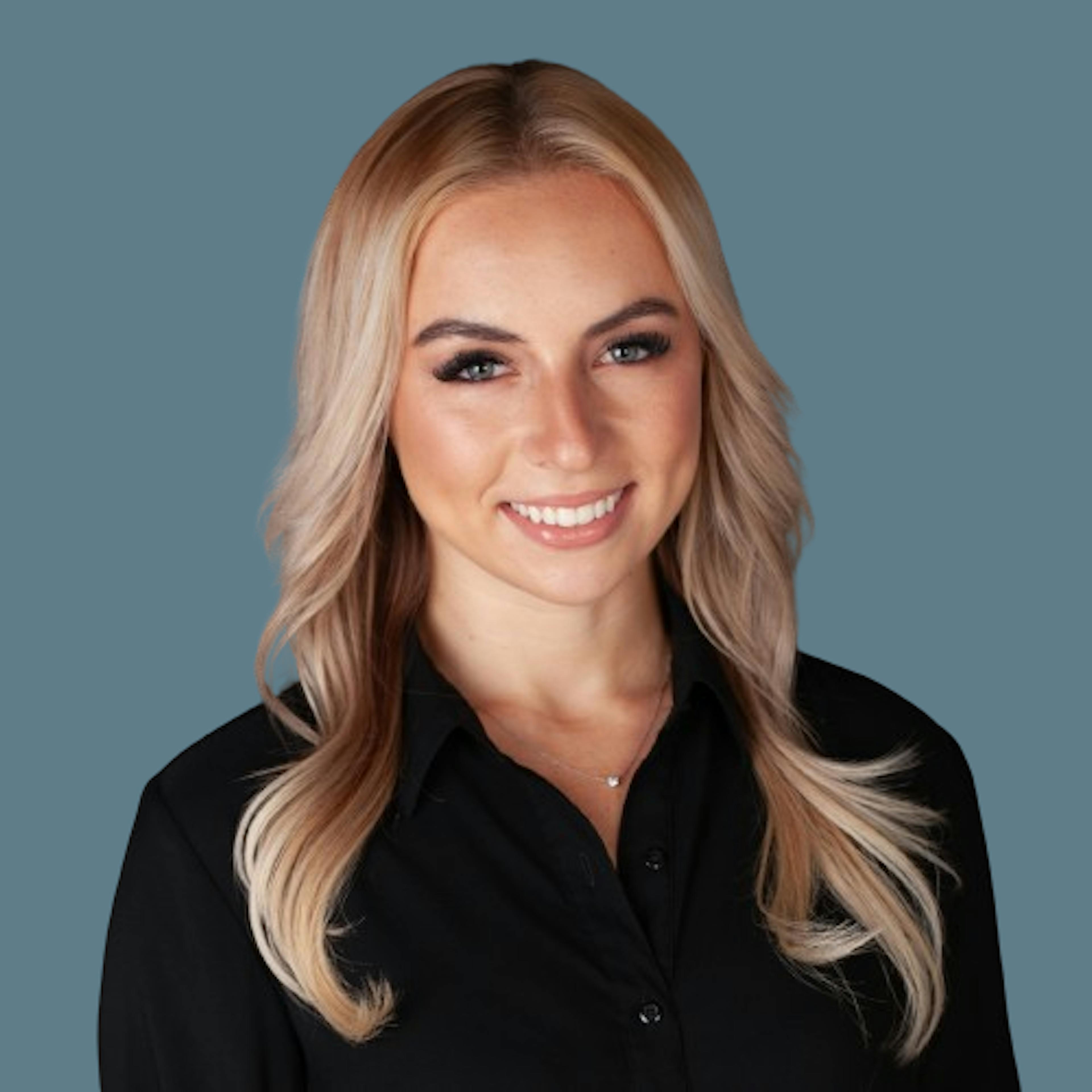 headshot image of Monika Radziwanoswski who is a business representative at Dark Alpha Capital