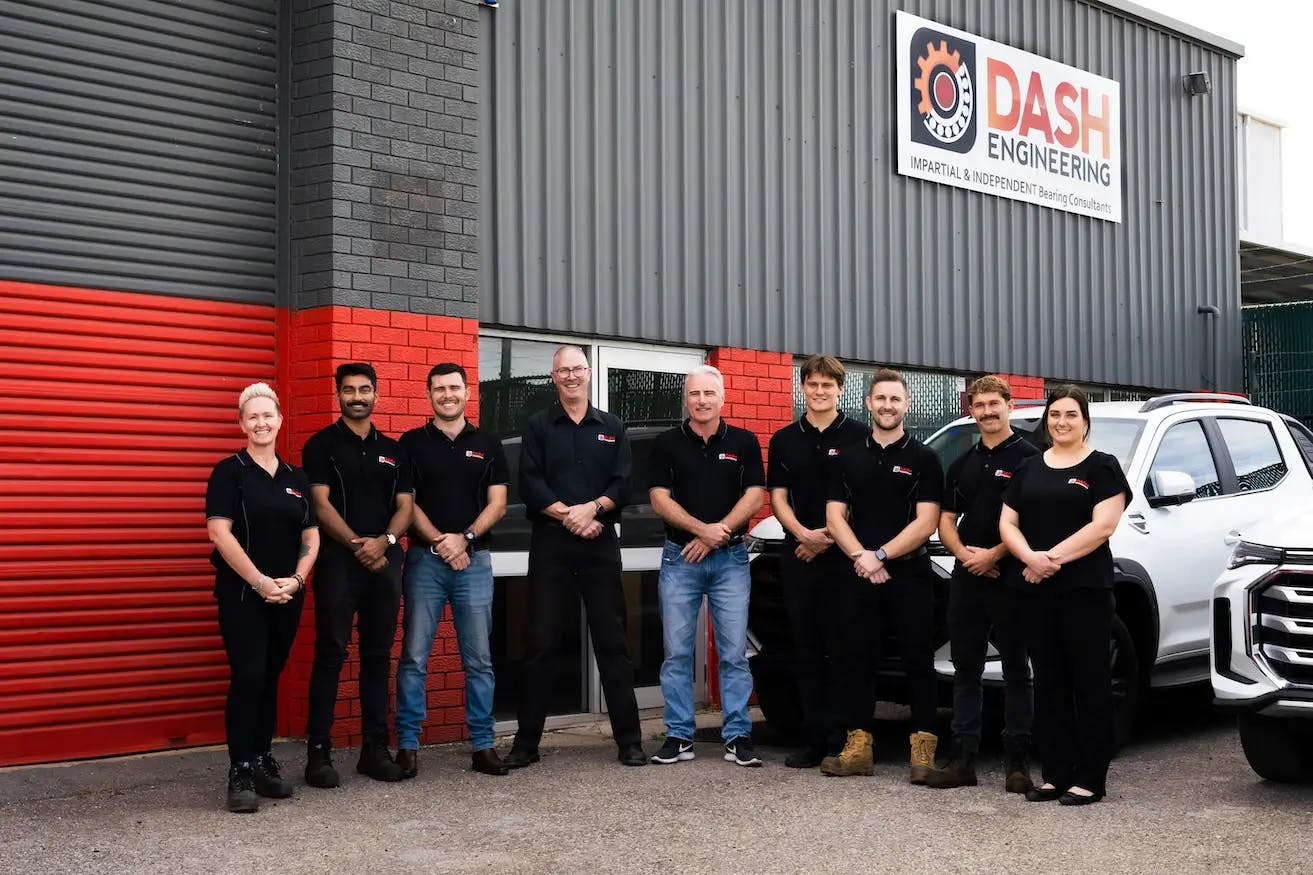 A team of engineering professionals standing outside the DASH Engineering workshop, an independent consultancy specialising in diagnosing and preventing bearing failure.