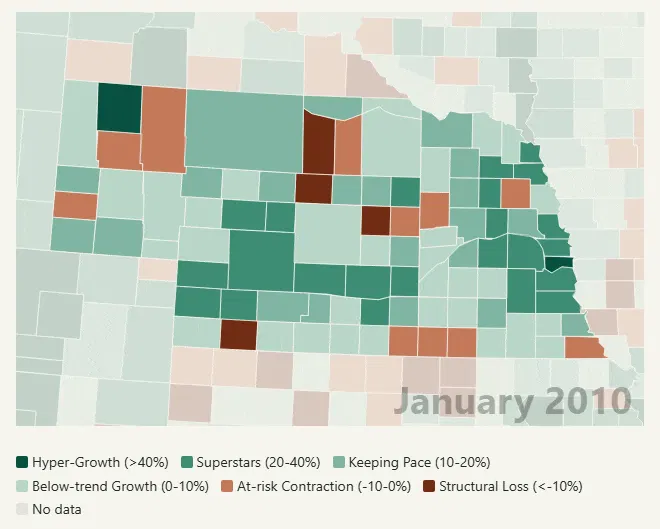 Animated map of Nebraska, January 2010 to July 2026, with each county shaded by the change in its civilian labor force against the same month 20 years earlier. Counties turn from green and gray to red across most of the state, leaving a green cluster around Omaha in the east. Sarpy County is the darkest green at 52% growth, with Douglas County next to it at 24%.