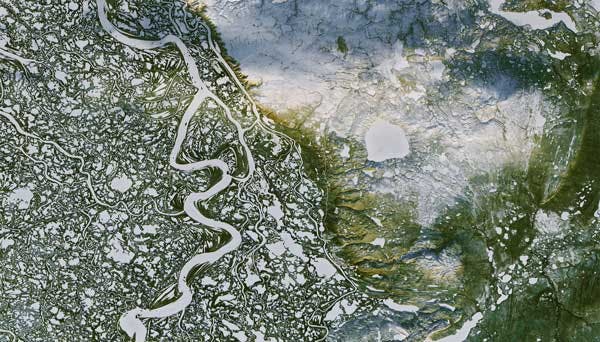 Watersheds are highly interconnected, often spanning geographical and political boundaries. Mackenzie River Delta, Northwest Territories (Image: NASA Earth Observatory).