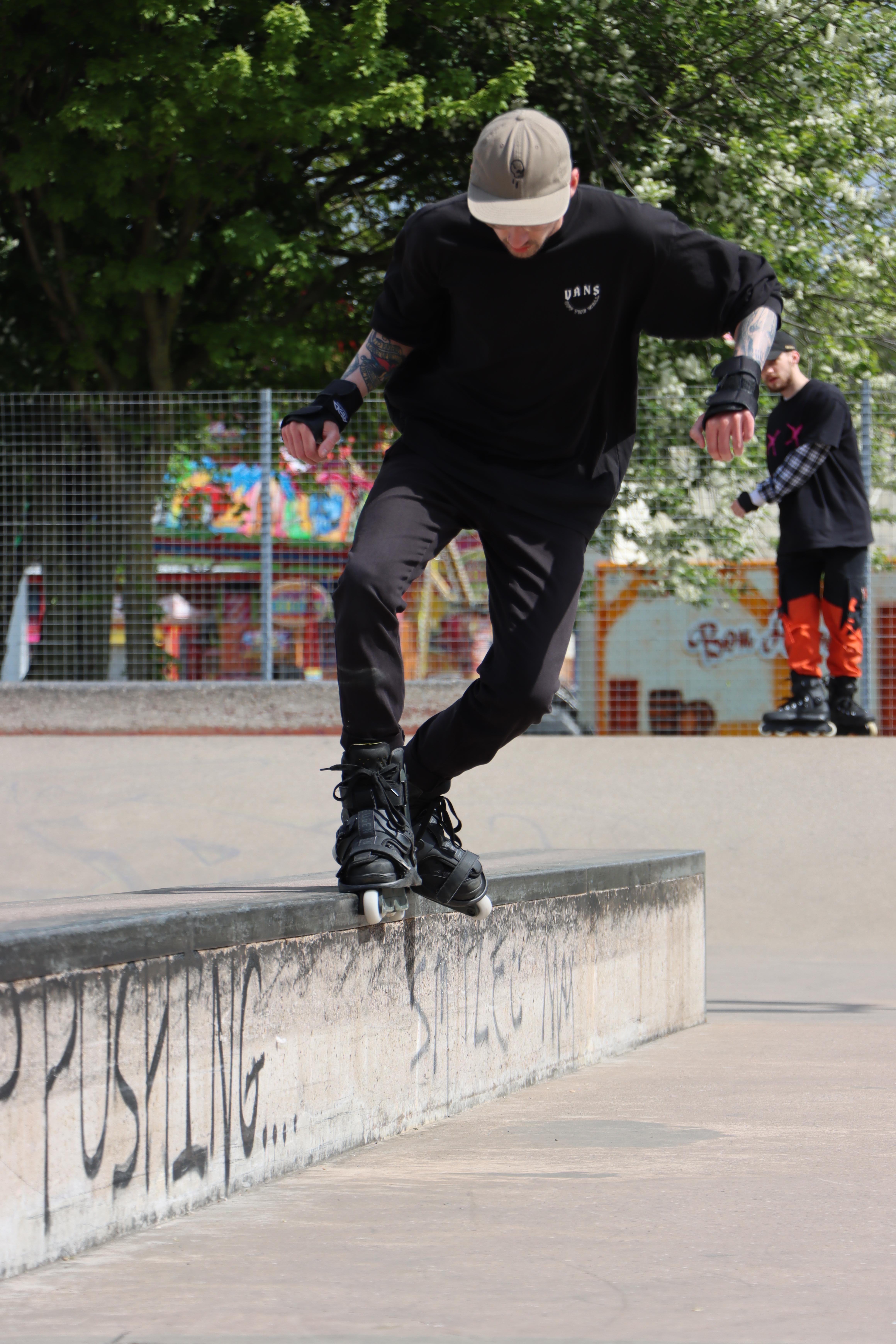 Me doing a Mizou grind on rollerblades