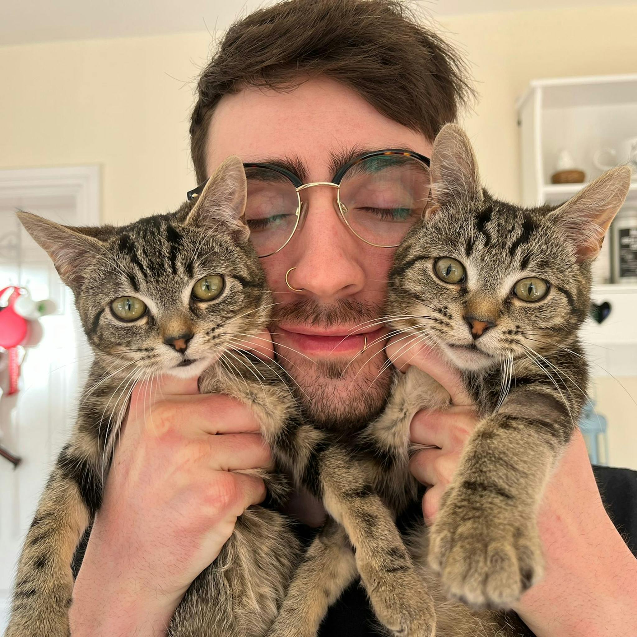 Me holding my two kittens, Jaskier and Cirilla