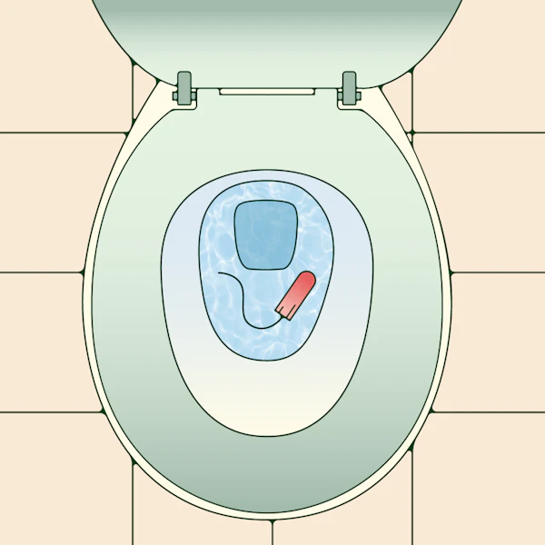 A floating tampon dropped in a toilet.