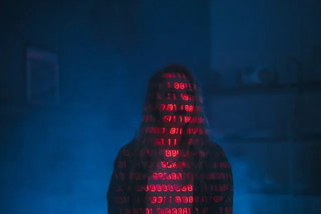 Image of a girl with red text projection on her body