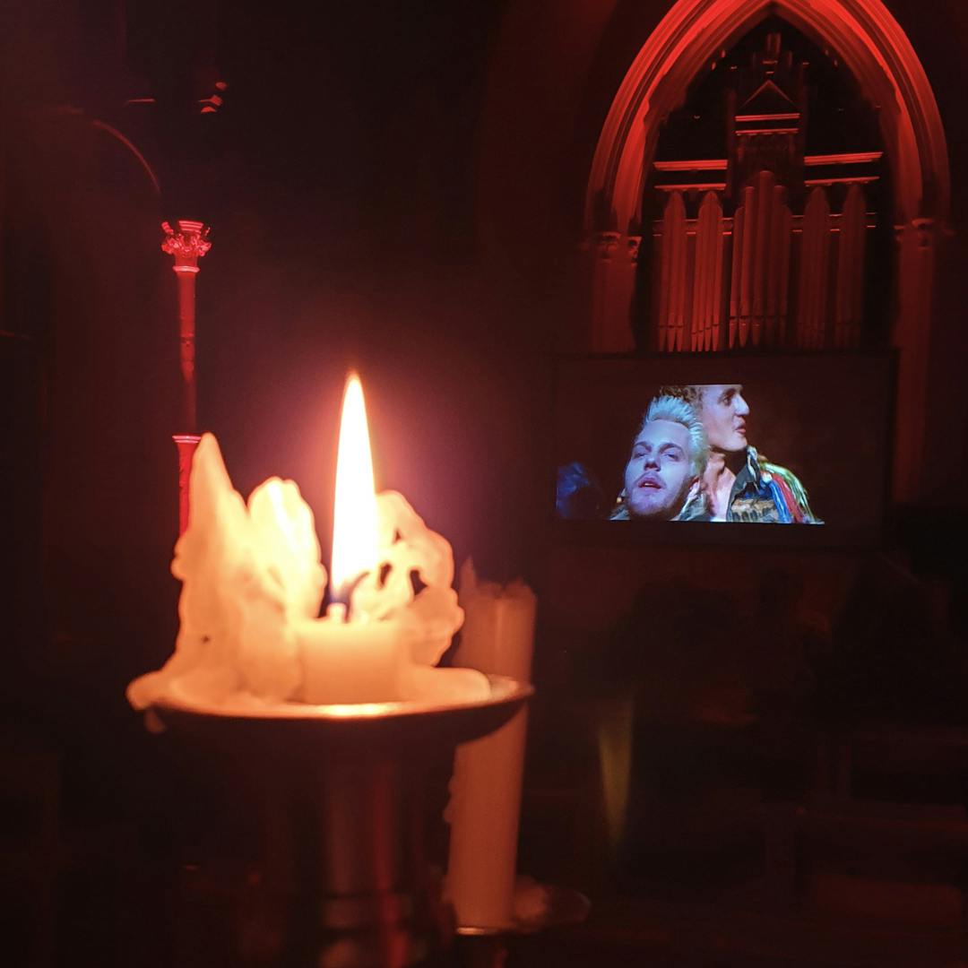 A screening of Lost Boys in a candle lit church at Harrogate Horror Film Festival
