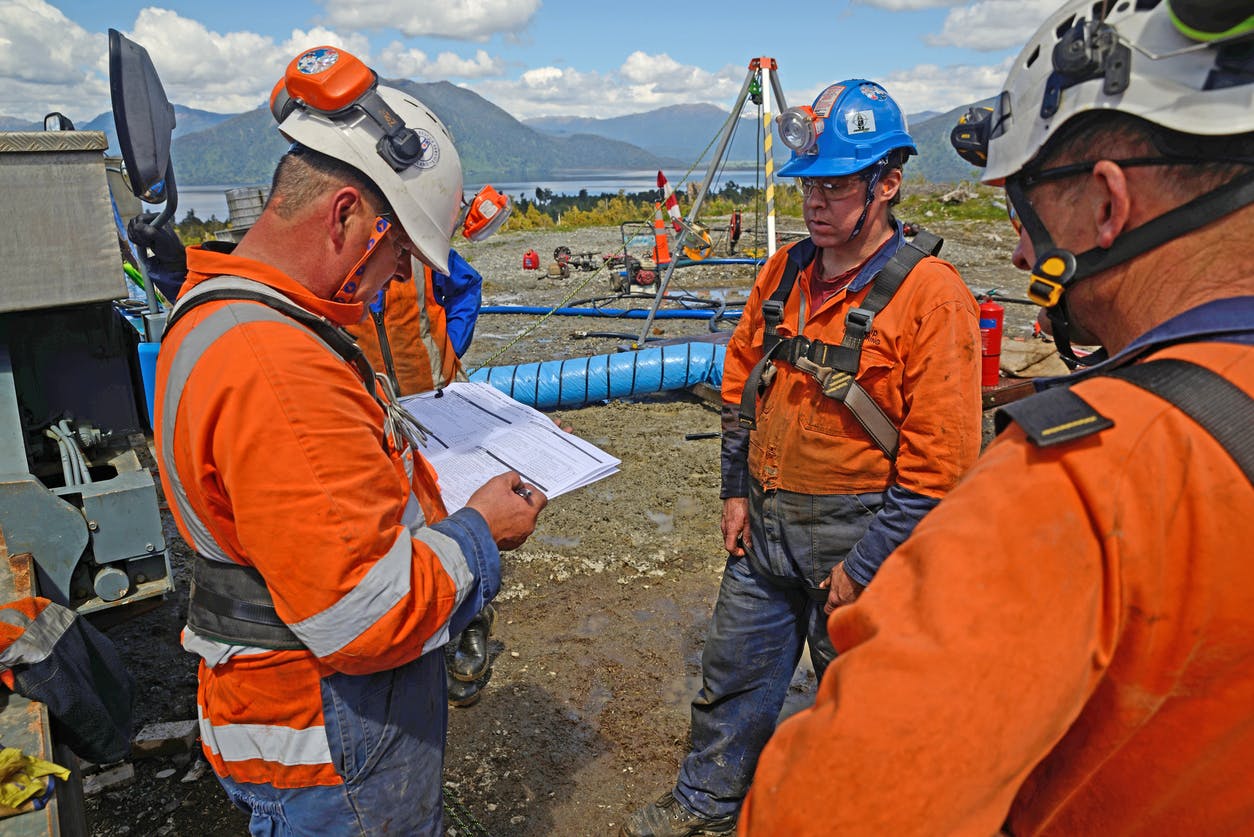 Field operations technicians manually filling a form
