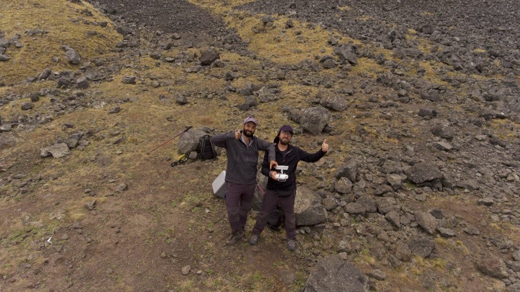 Dr. Renato Borràs-Chàvez and Luciano Hiriart-Bertrand standing on a rocky ground in Chile