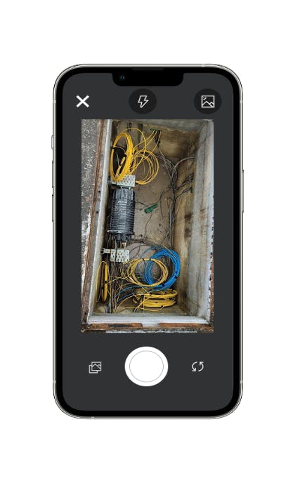 smartphone with a fiber manhole photo
