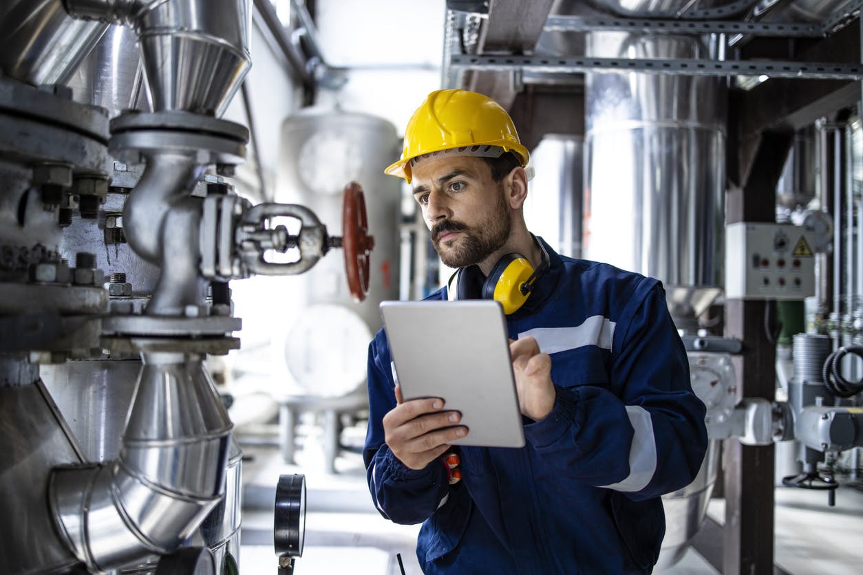 Technician inspecting an asset for quality control