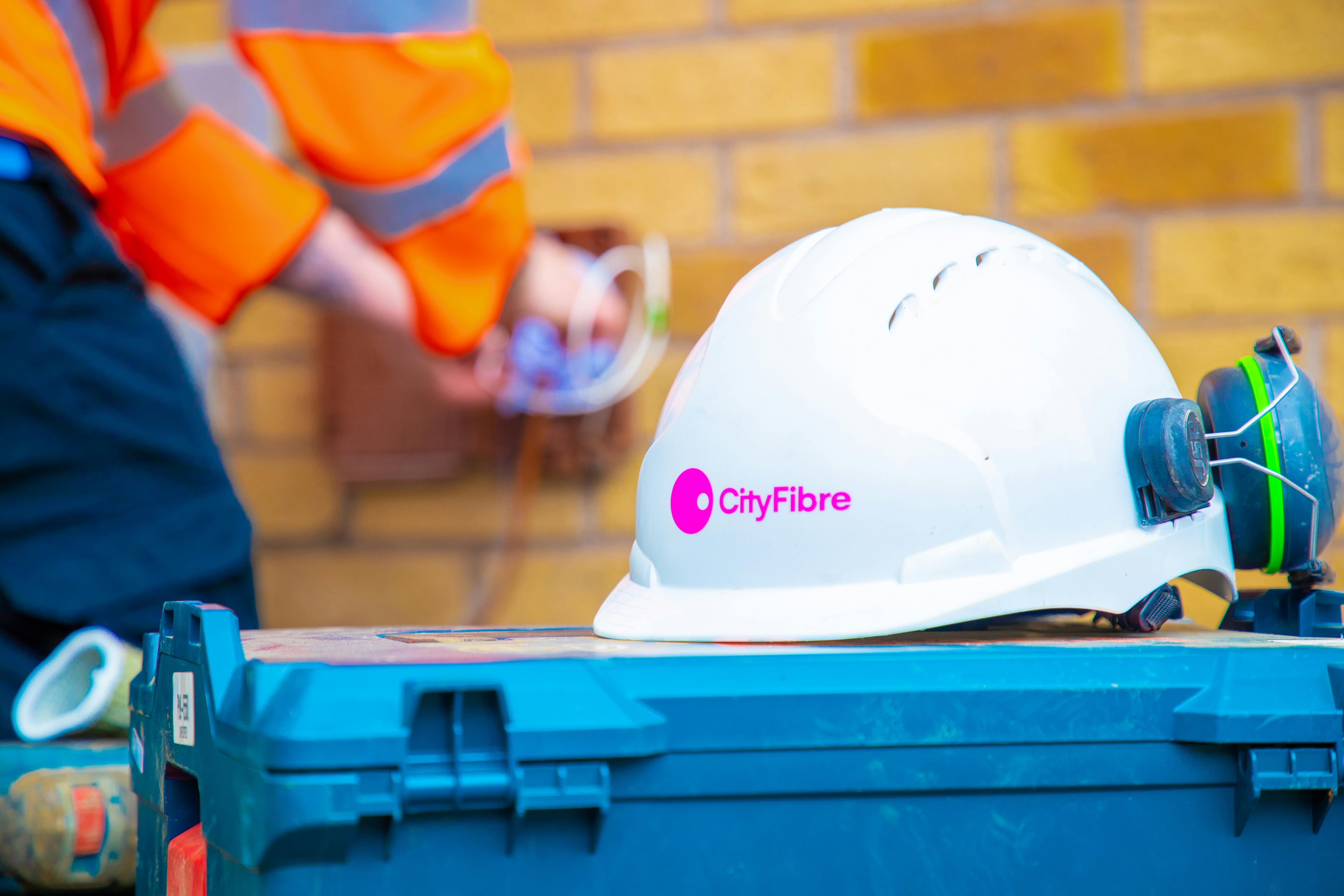 White Fibre optic engineer's helmet with CityFibre logo in pink